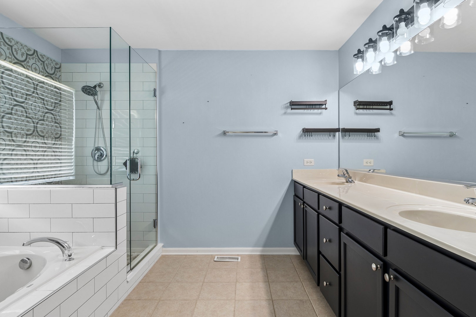 711 Jorstad Drive, North Aurora, IL 60542 Recently upgraded tile and glass shower doors!