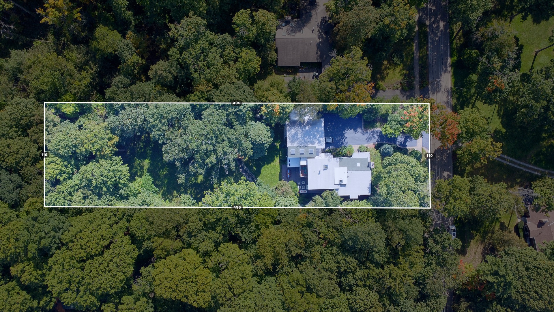 View of the home and yard from above