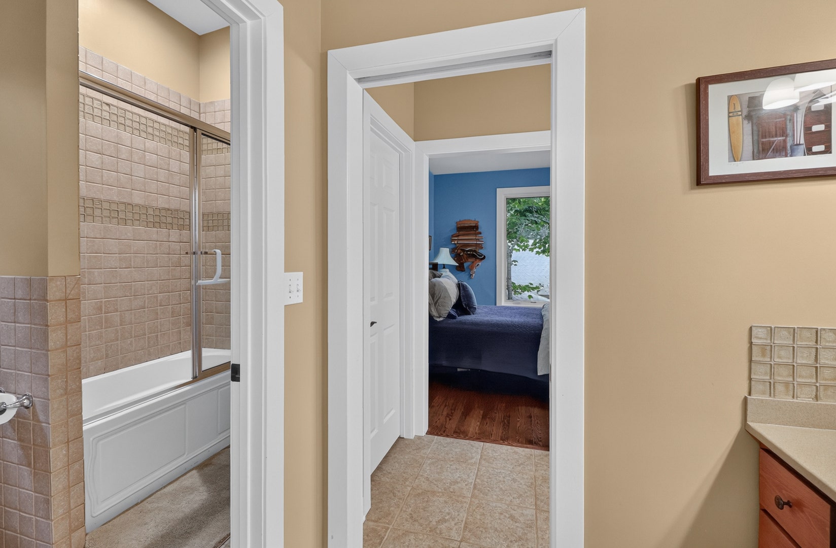 Bedrooms #2 and #3's shared bathroom with two priv