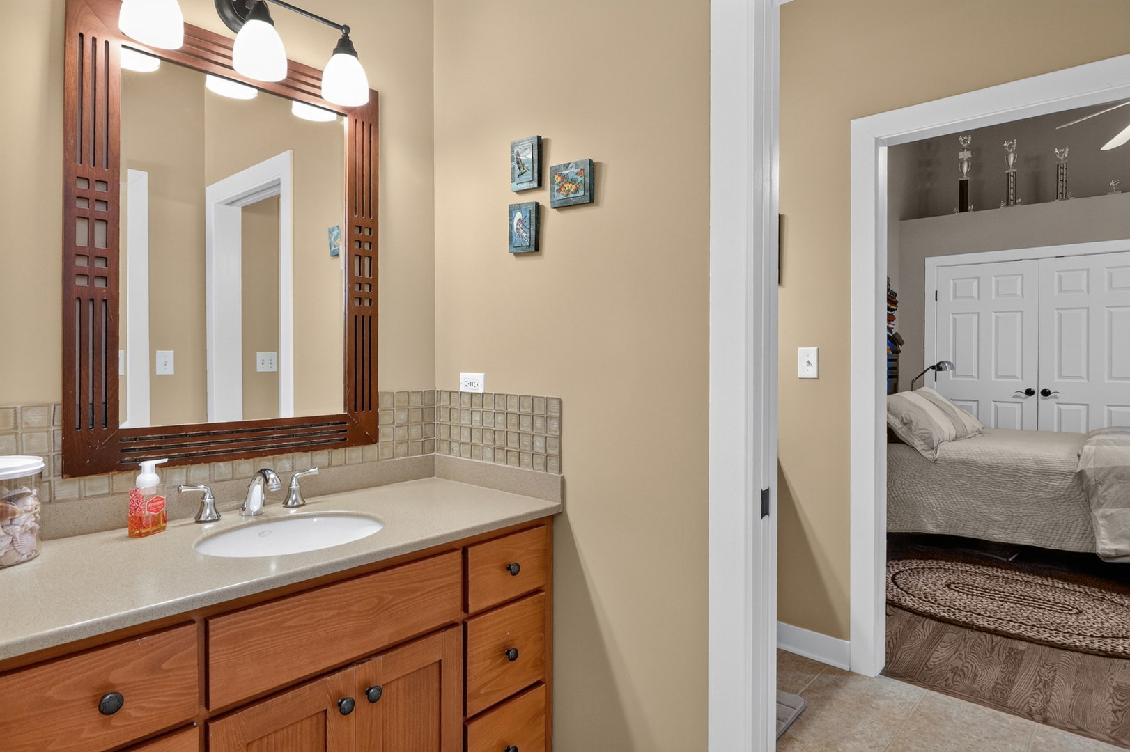 Bedrooms #2 and #3's shared bathroom with two priv