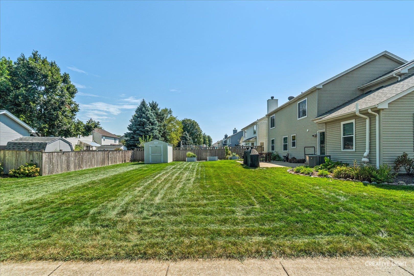 52 Blackberry Trail, Aurora, IL 60506 Large corner lot with 32x22 concrete patio and fan