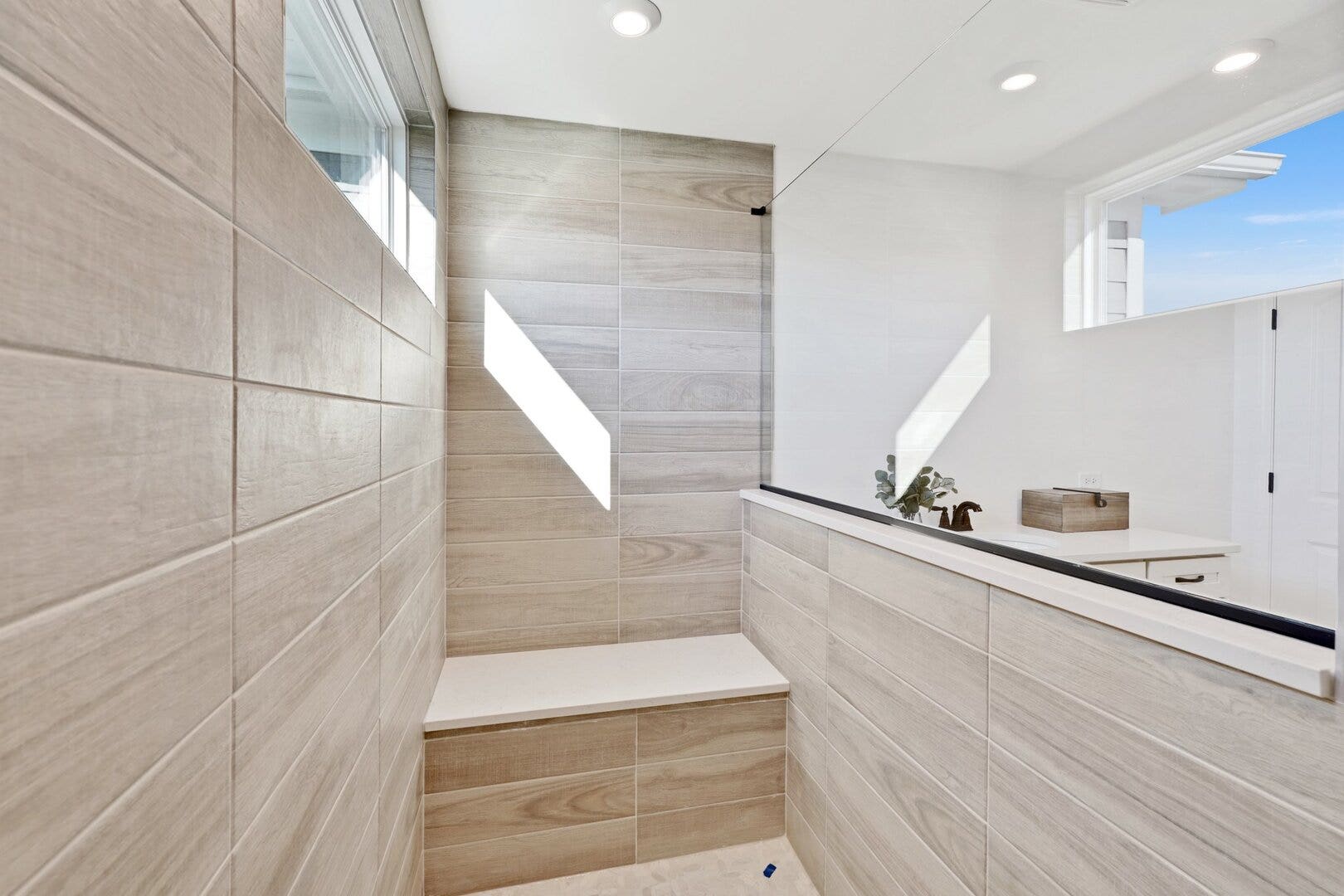 large walk-in seated tiled shower