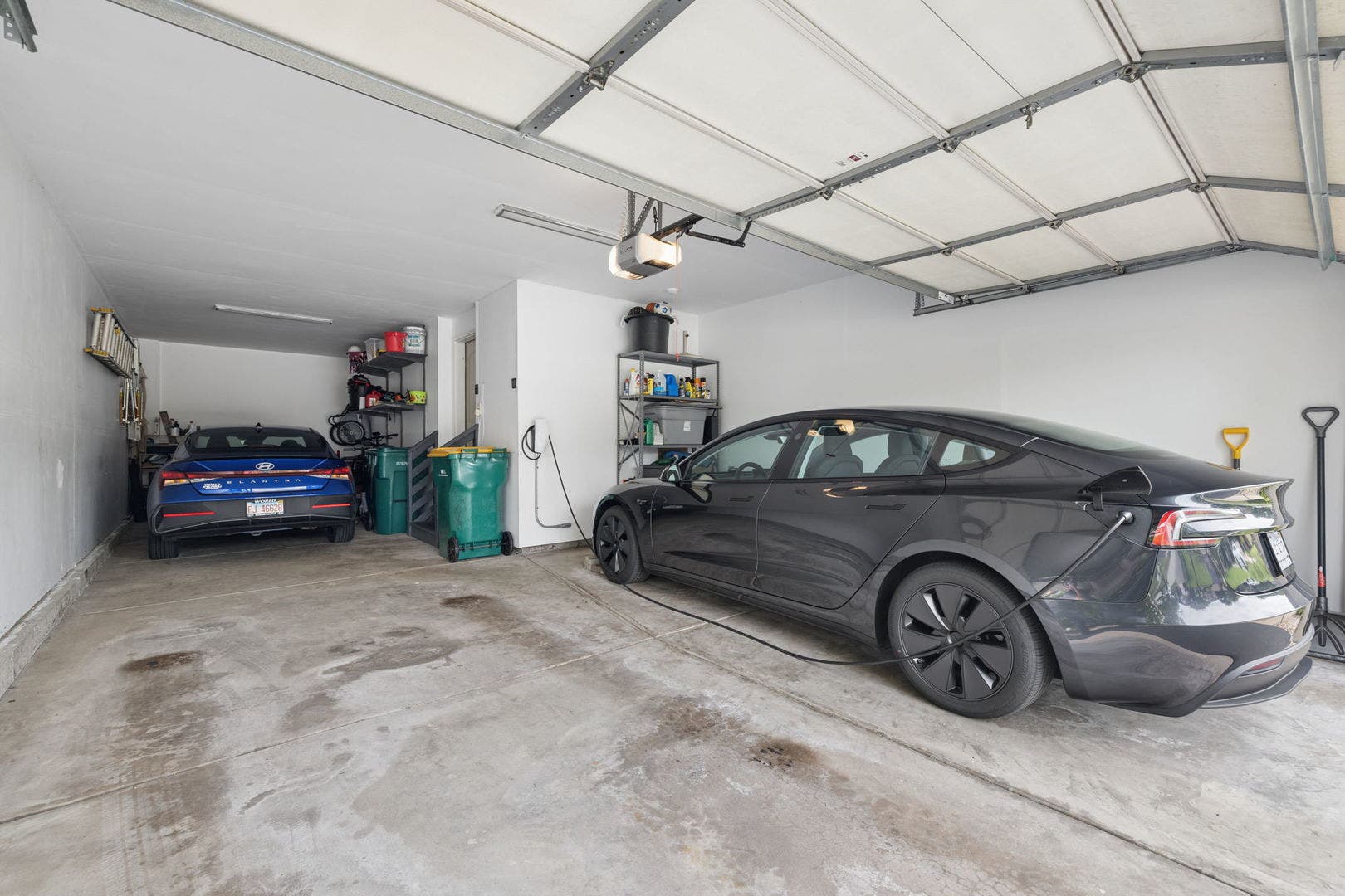 3 car tandem garage with Universal electric car ch