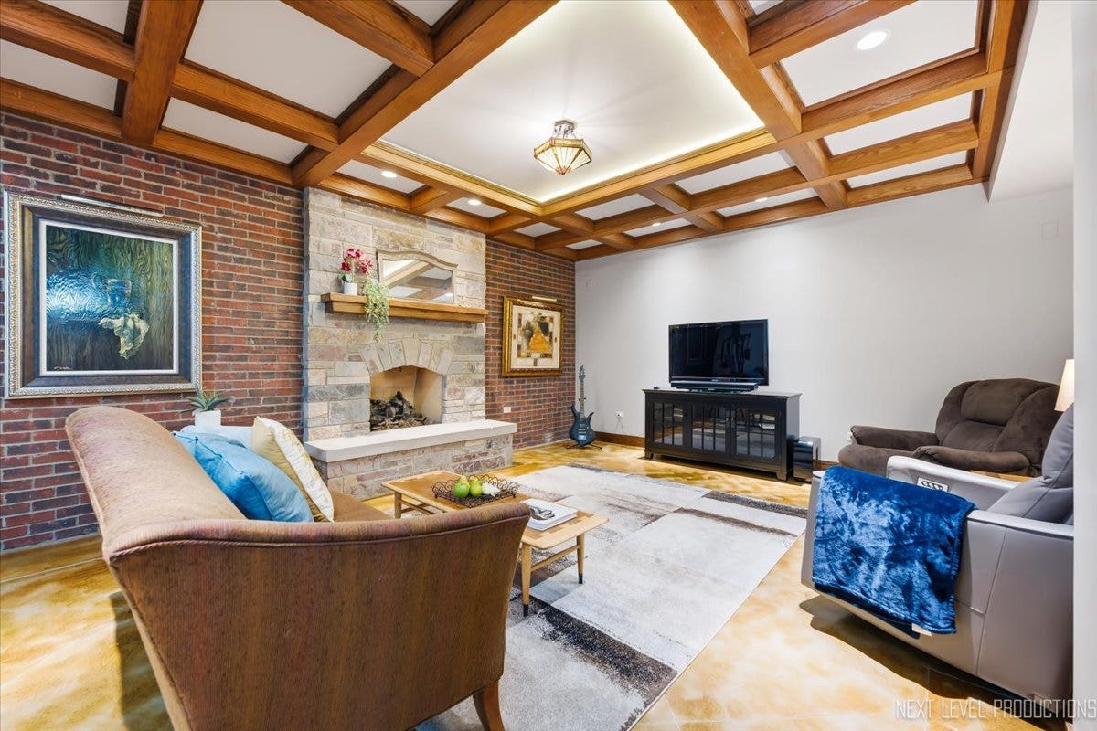 627 Ritter Drive, Batavia, IL 60510 Lower Level family room with Fireplace and boxed c