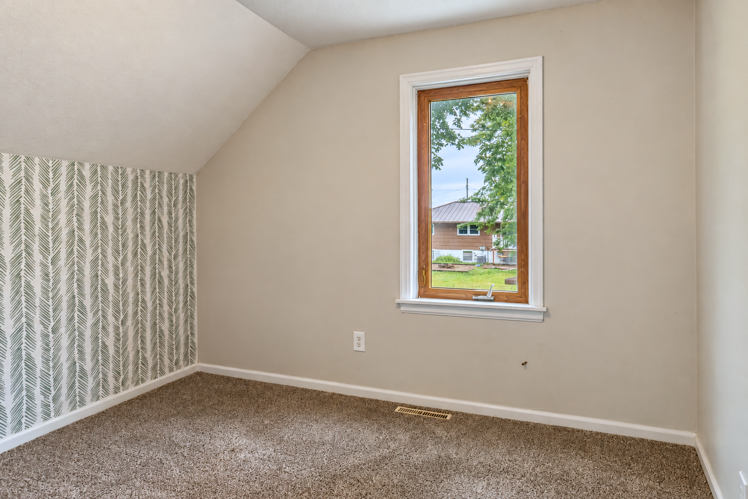 530 4th Street, Green Isle, MN 55338 Bright second bedroom with newer carpeting, natural light and charming architectural character.