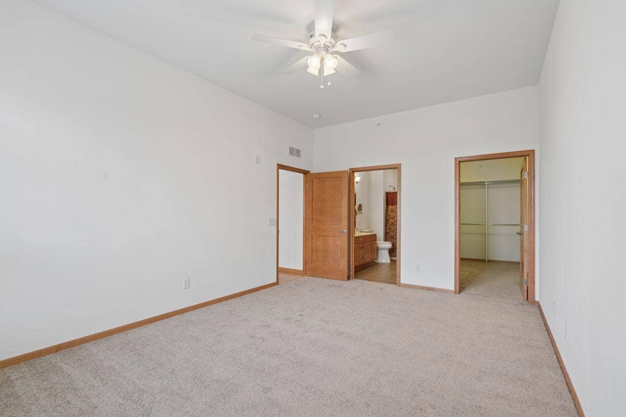1244 County Road D E, #205, Maplewood, MN 55109 Primary bedroom with ensuite bath and spacious walk-in closet