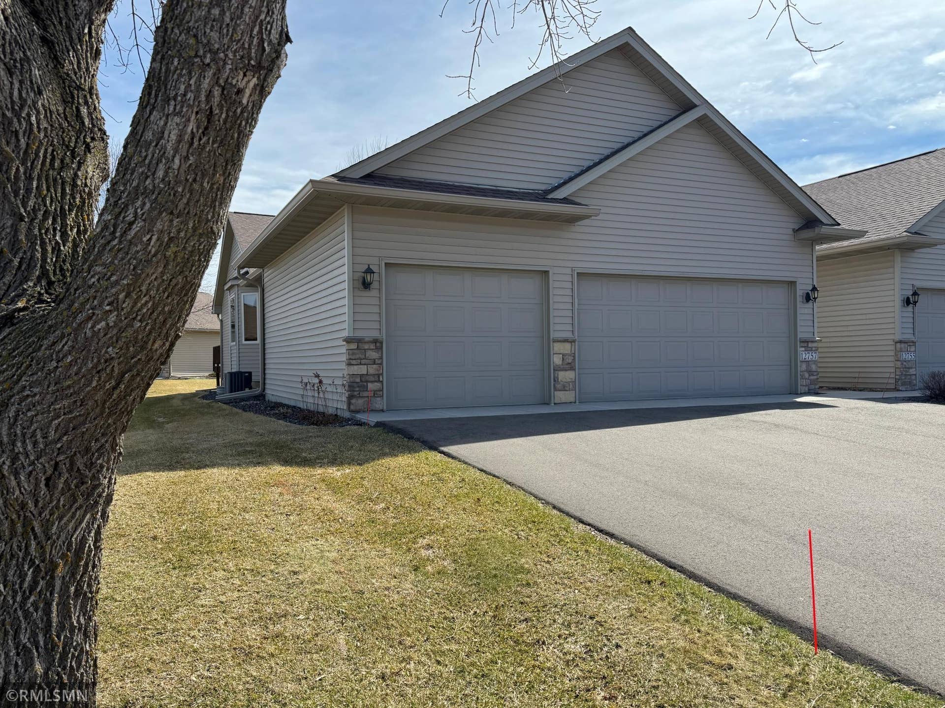 12757 Ferrara Avenue N, Hugo, MN 55038 New concrete apron & asphalt driveway.