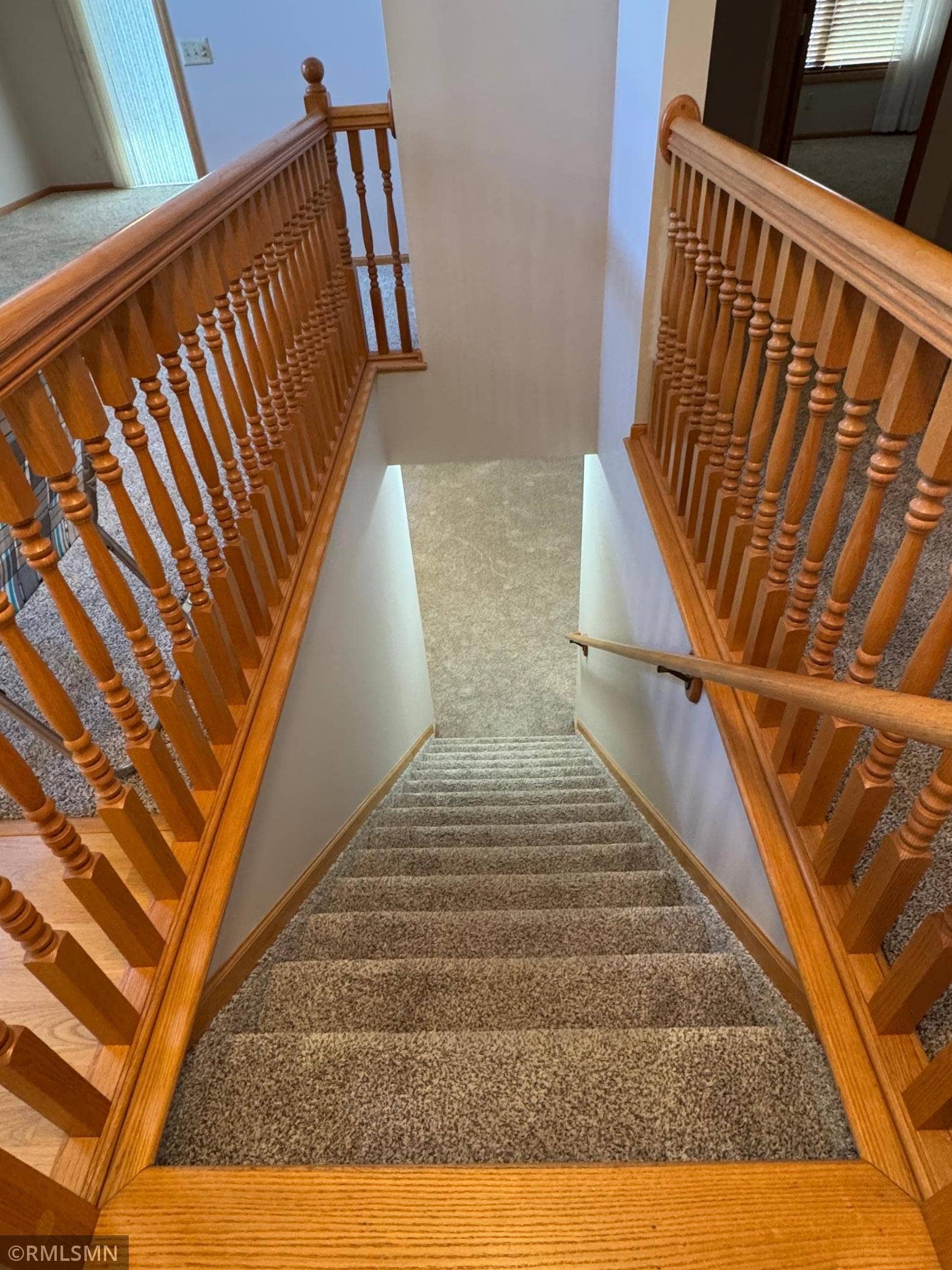 12757 Ferrara Avenue N, Hugo, MN 55038 Let's head downstairs.