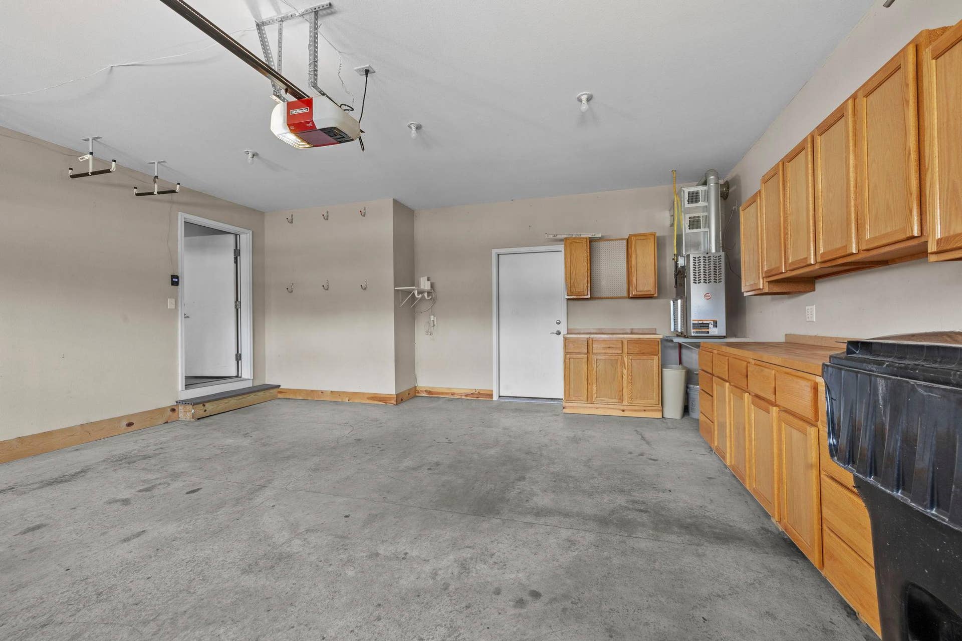 319 Bellwood Avenue, Maplewood, MN 55117 The property also includes a heated, 2-car, attached garage for year-round vehicle protection with cabinetry and counter workspace.