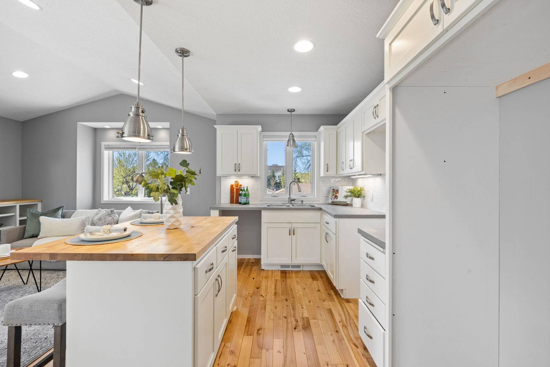 319 Bellwood Avenue, Maplewood, MN 55117 It includes a full kitchen with wood flooring and space for appliances.
