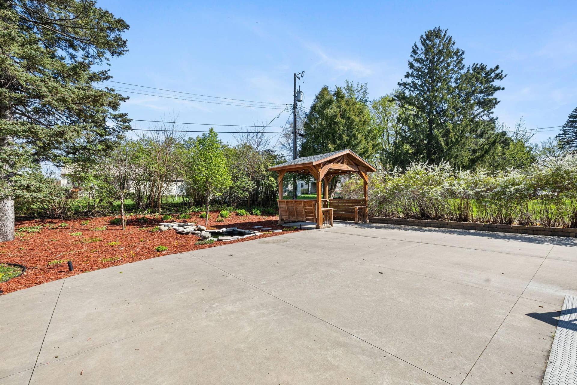 319 Bellwood Avenue, Maplewood, MN 55117 The patio is complemented by a nearby stone water feature and thoughtfully designed landscaping that enhances the homes curb appeal.