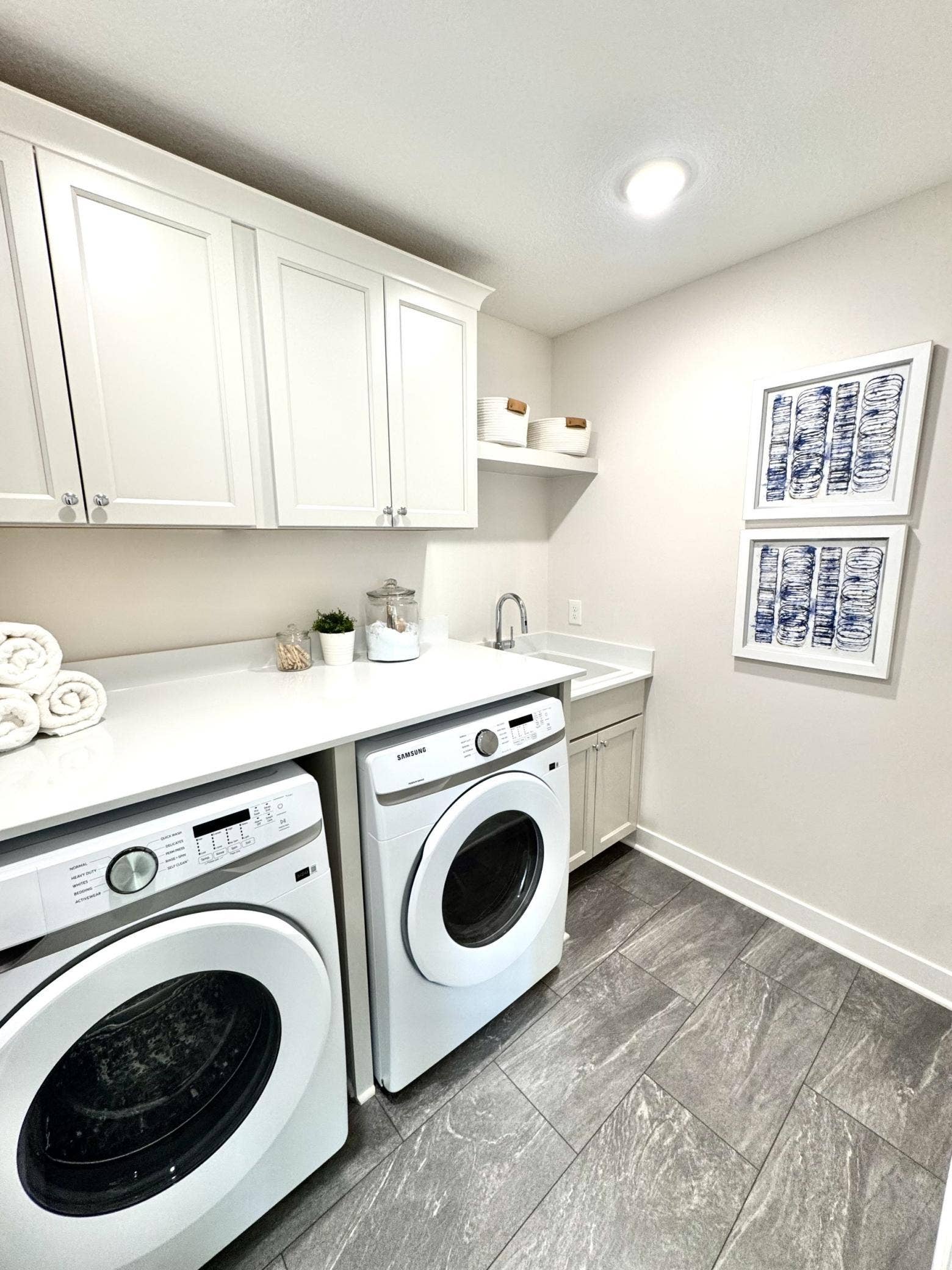 3644 Knightsbridge Lane, Lake Elmo, MN 55042 Laundry with cabinetry, deep sink, and quartz countertops
