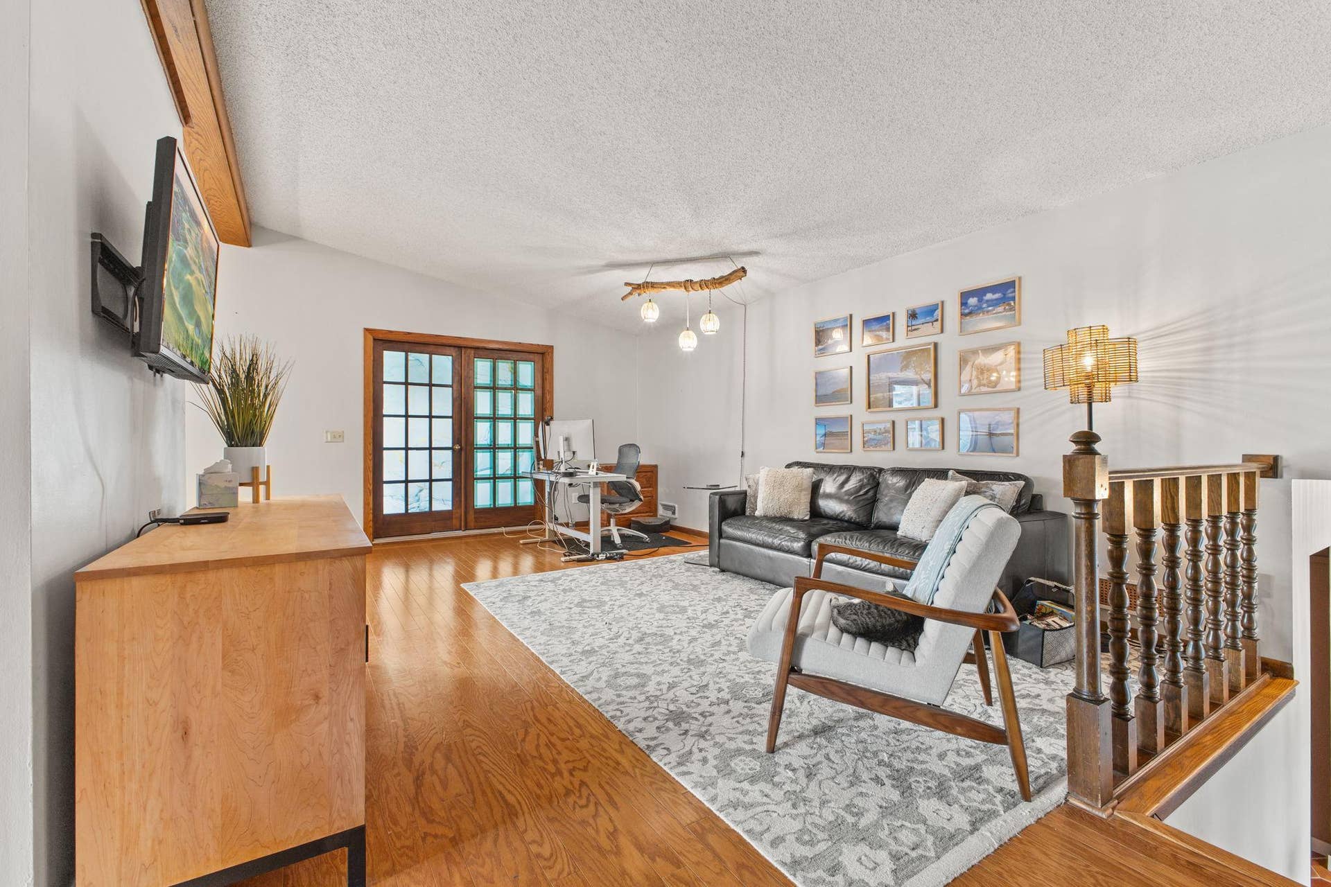 Main level living room features vaulted ceilings.
