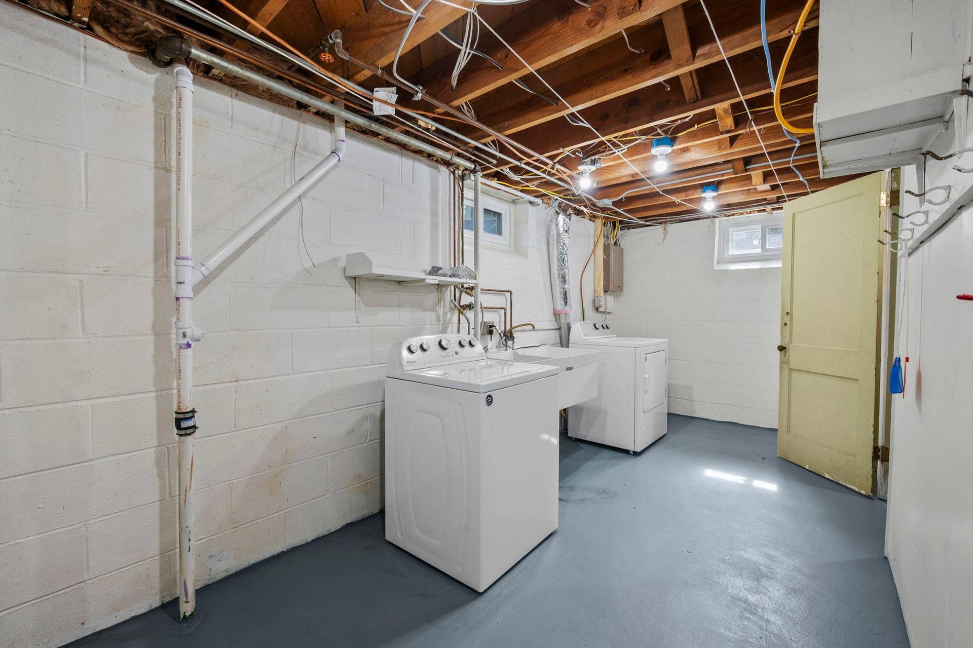 The Laundry/Utility room offers tons of storage possibilities