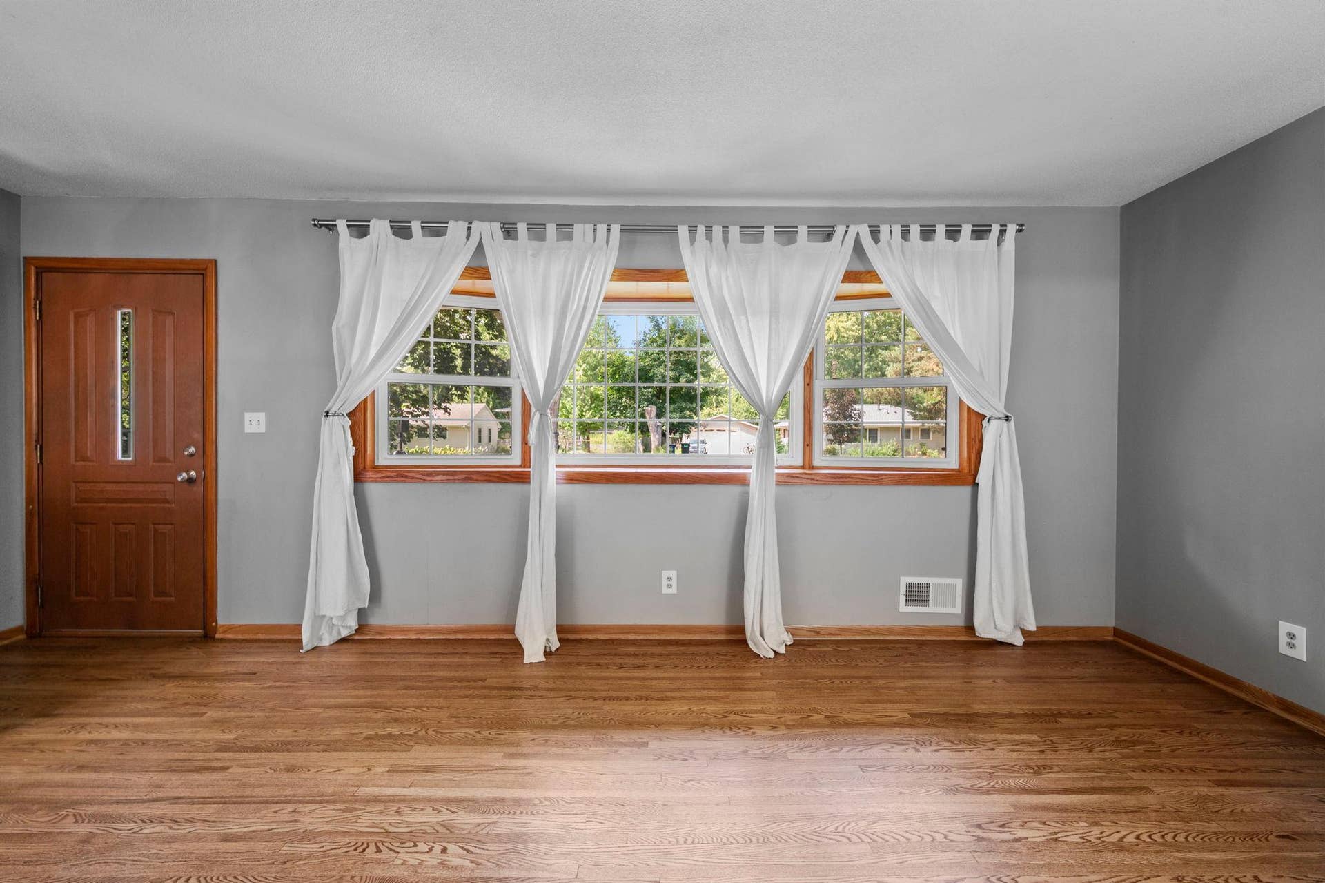 The Living Room boasts a bow window to bring in the sunlight