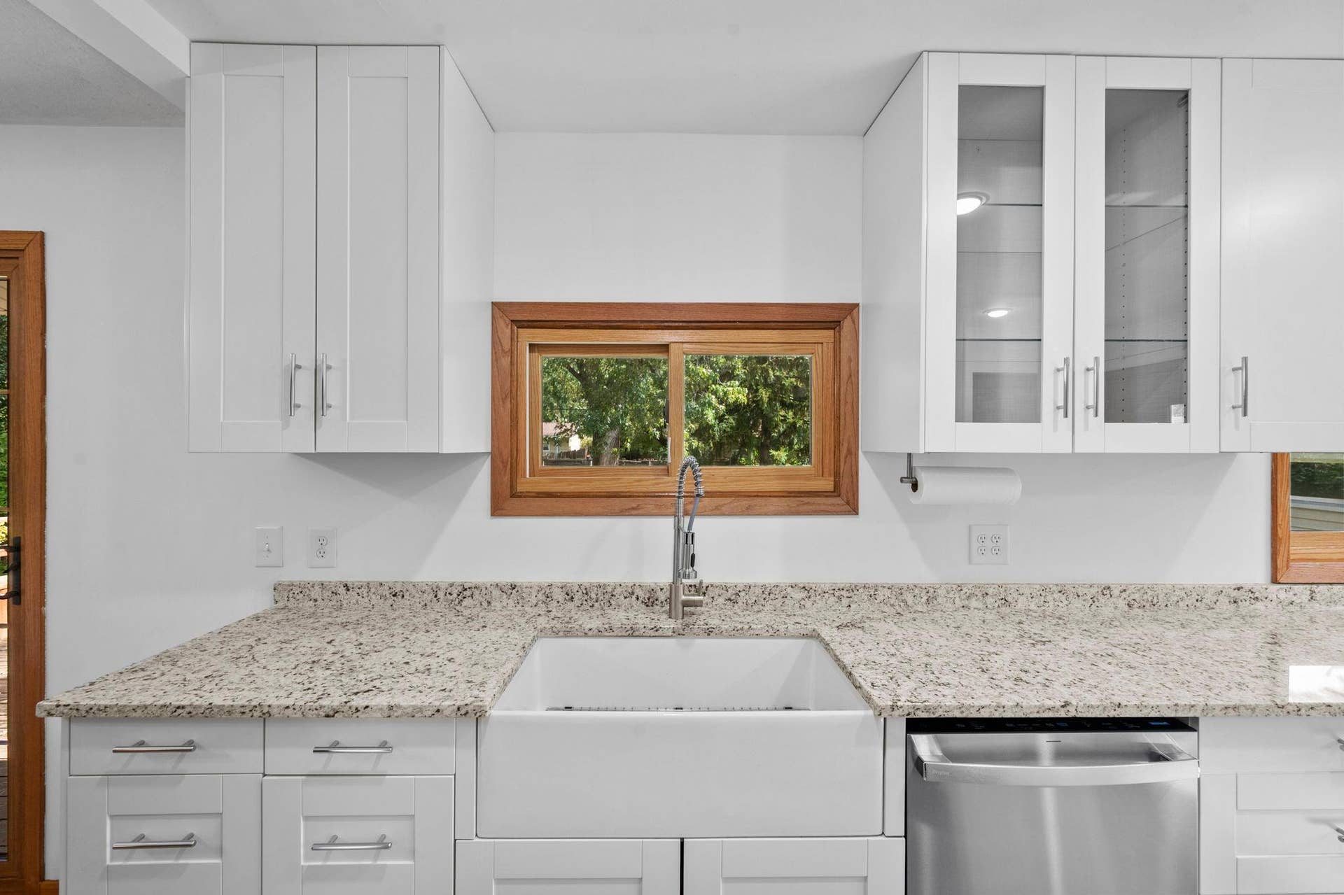 The Kitchen boasts a farmhouse style sink!