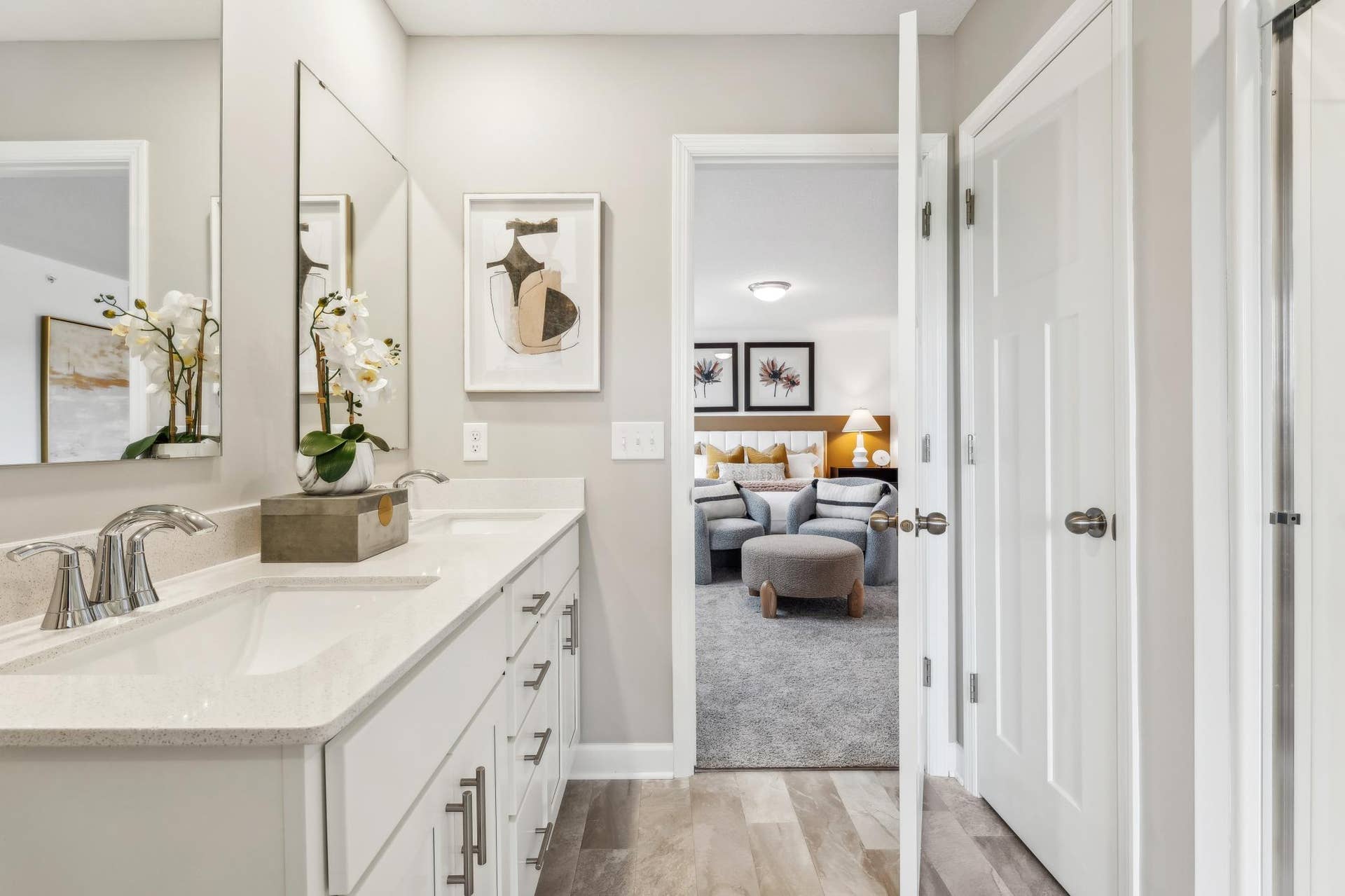 5353 Long Pointe Pass, Woodbury, MN 55129 (Photo of a model home, actual homes finishes will vary) The spacious owner's ensuite bath features a double sink vanity with plenty of storage, a linen closet, and a shower.