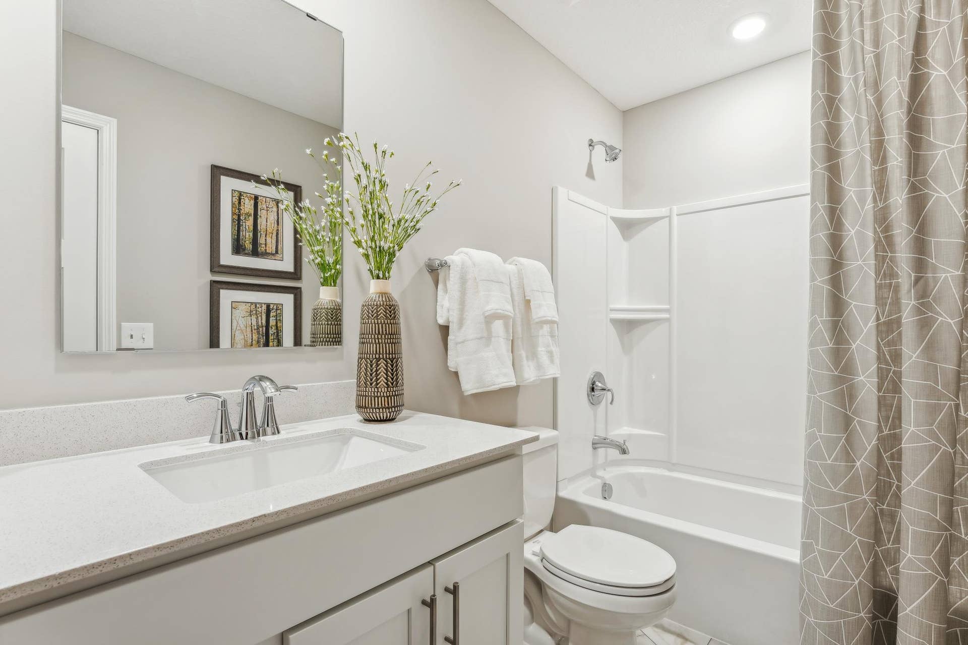5353 Long Pointe Pass, Woodbury, MN 55129 (Photo of a model home, actual homes finishes will vary) The secondary bath on the upper level provides the perfect amount of space!.jpg