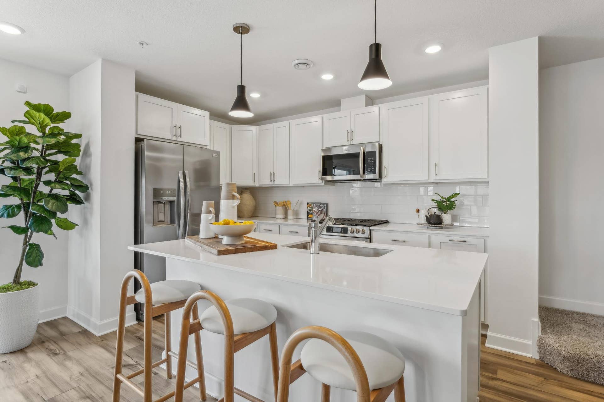 5353 Long Pointe Pass, Woodbury, MN 55129 (Photo of a model home, actual homes finishes will vary) What a stunning kitchen with all brand new stainless steel appliance!