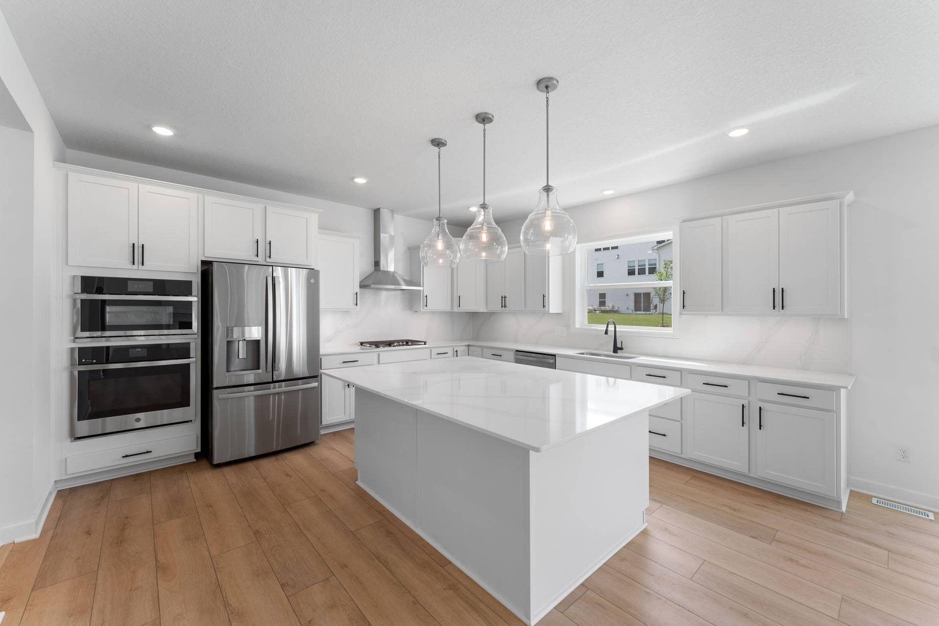 1836 Royal Boulevard N, Lake Elmo, MN 55042 (Photo of a decorated model, actual homes finishes will vary) Coated in quartz countertops and surrounded by pristine white cabinets, our smartly designed kitchen leaves plenty of room for the chef to work!