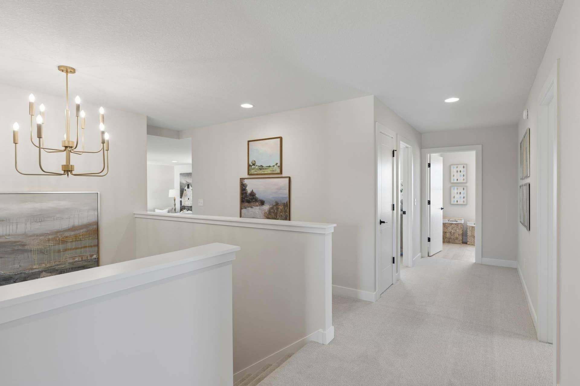 5003 Airlake Drive, Woodbury, MN 55129 Large landing at top of stairs to upper level with gorgeous hanging light fixture.
