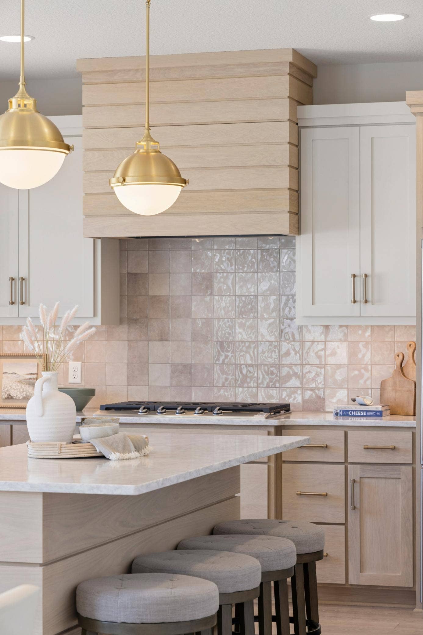 5003 Airlake Drive, Woodbury, MN 55129 Kitchen features white oak plank range hood and center island.