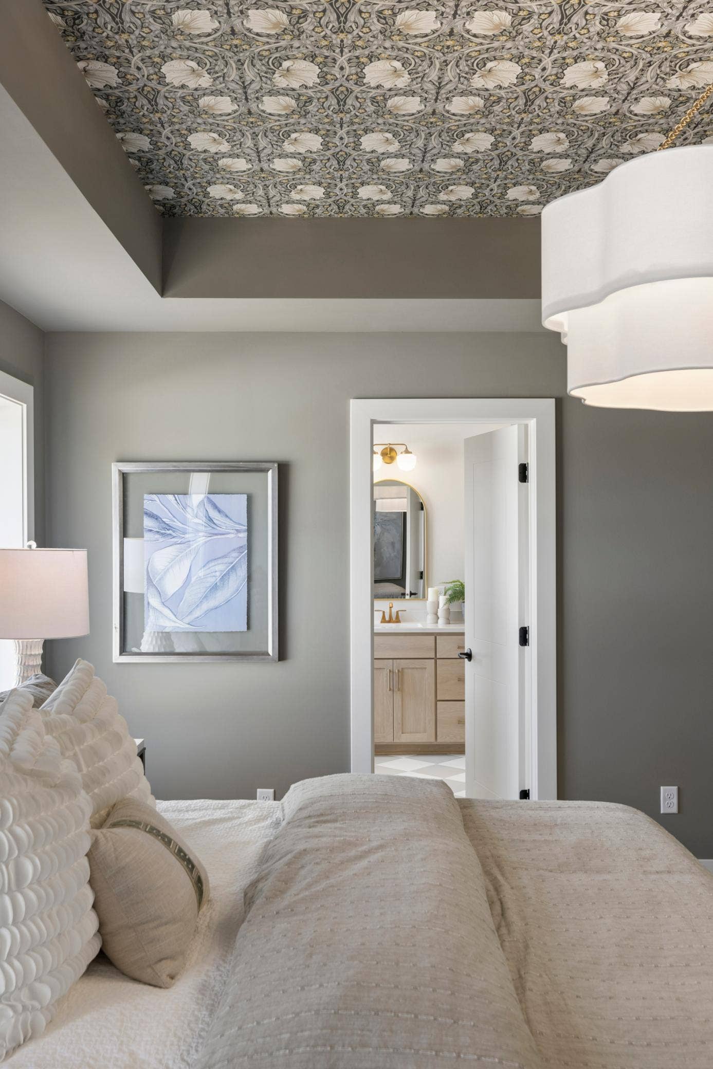 5003 Airlake Drive, Woodbury, MN 55129 Dramatic vaulted ceiling of primary bedroom along with hanging light.