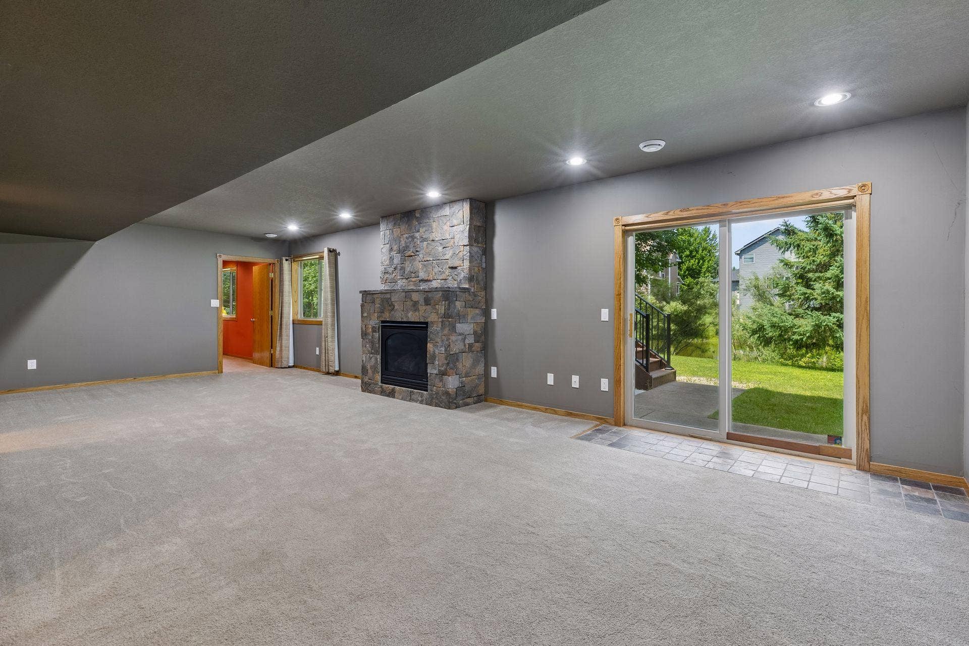 GAS FIREPLACE AND SLIDING DOOR TO PATIO