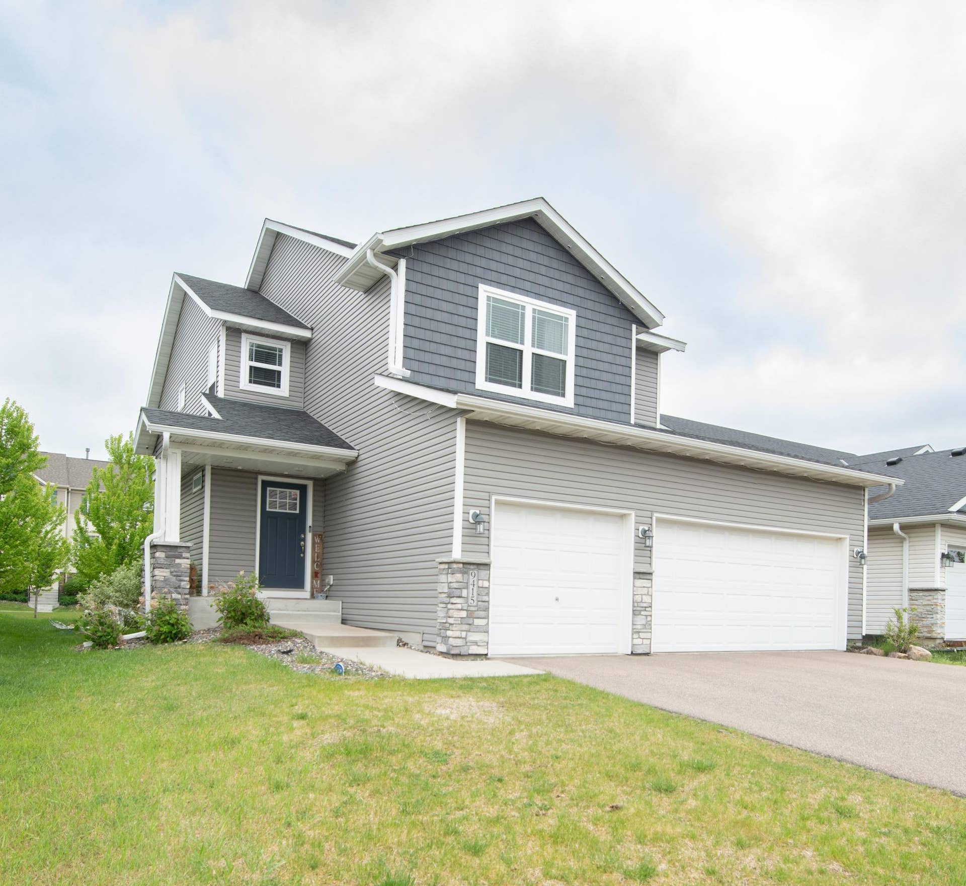 9415 Toledo Lane N, Brooklyn Park, MN 55443 Maroney Home from left view.jpg