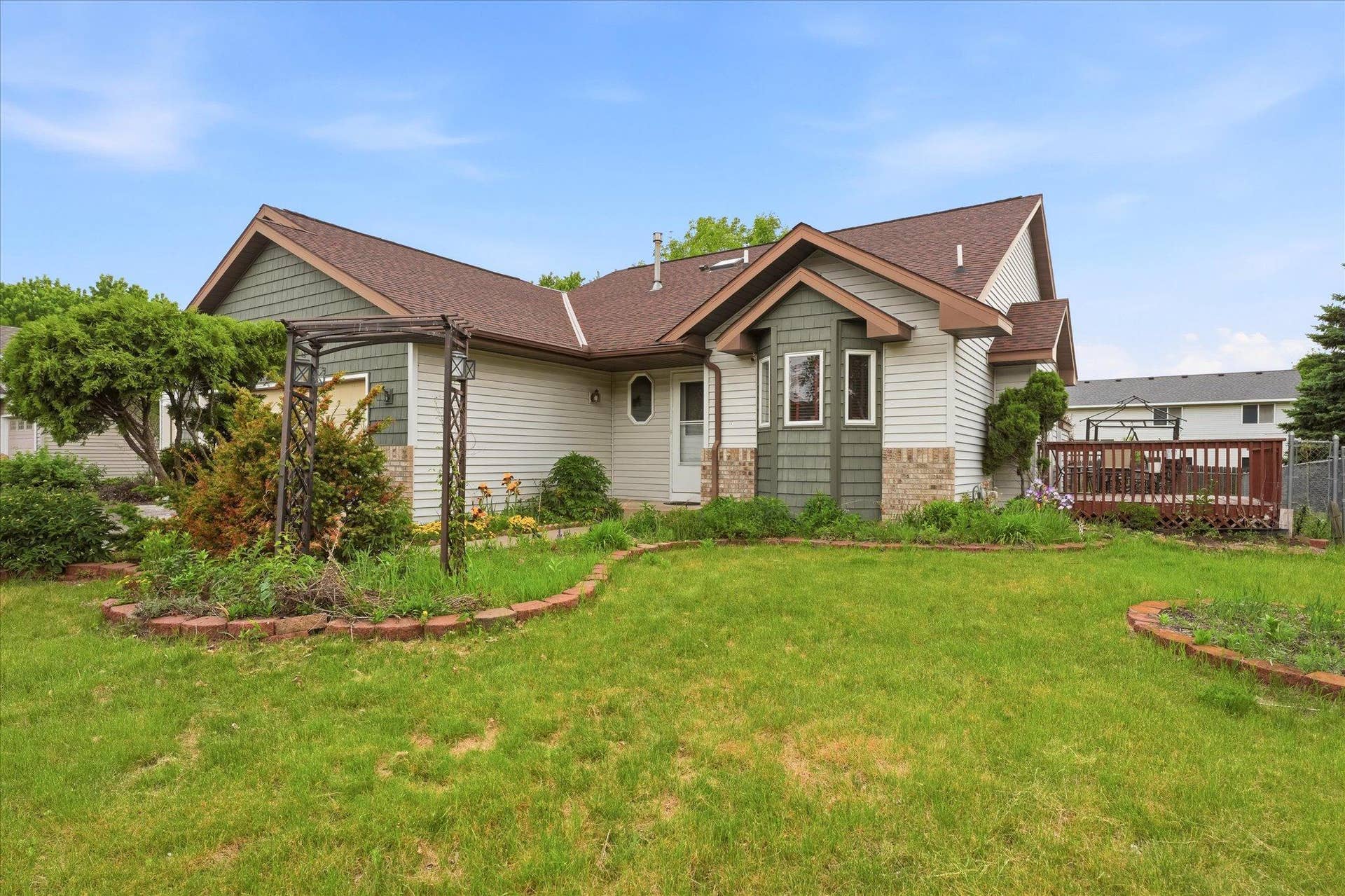 7208 90th Trail N, Brooklyn Park, MN 55445 Charming curb appeal with mature landscaping