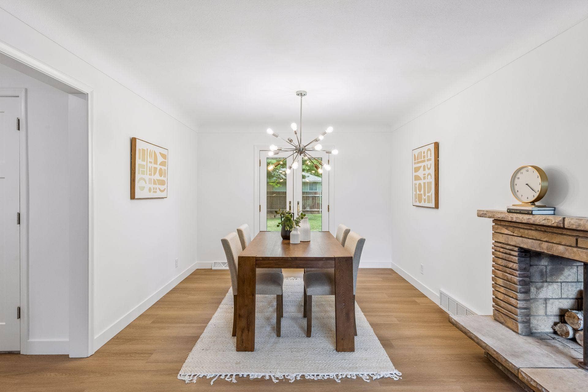 25x15 and 11x9 Living room and dining room with south and north-facing updated windows, new paint, new luxury vinyl flooring, and lighting.