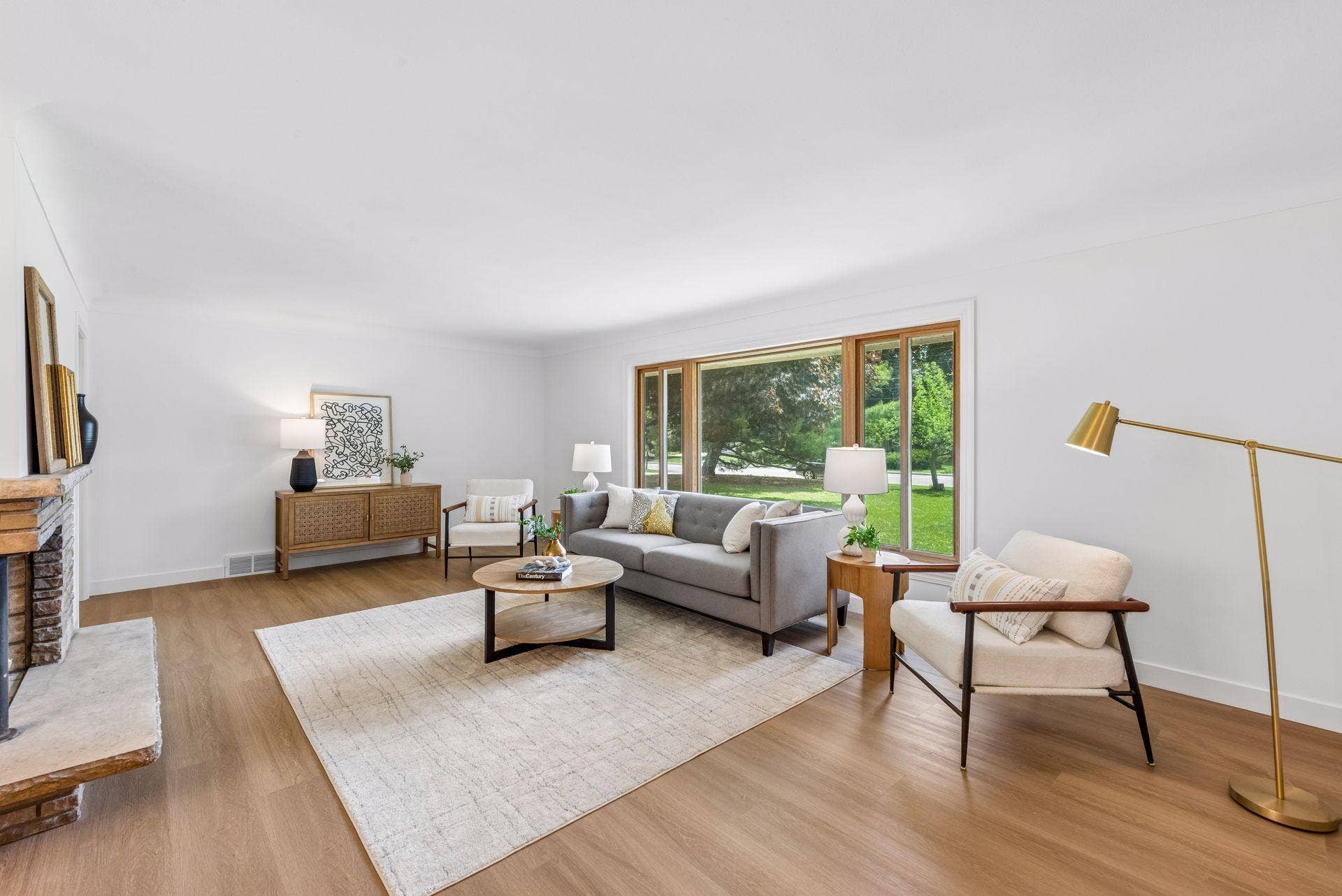 25x15 and 11x9 Living room and dining room with south and north-facing updated windows, new paint, new luxury vinyl flooring, and lighting.