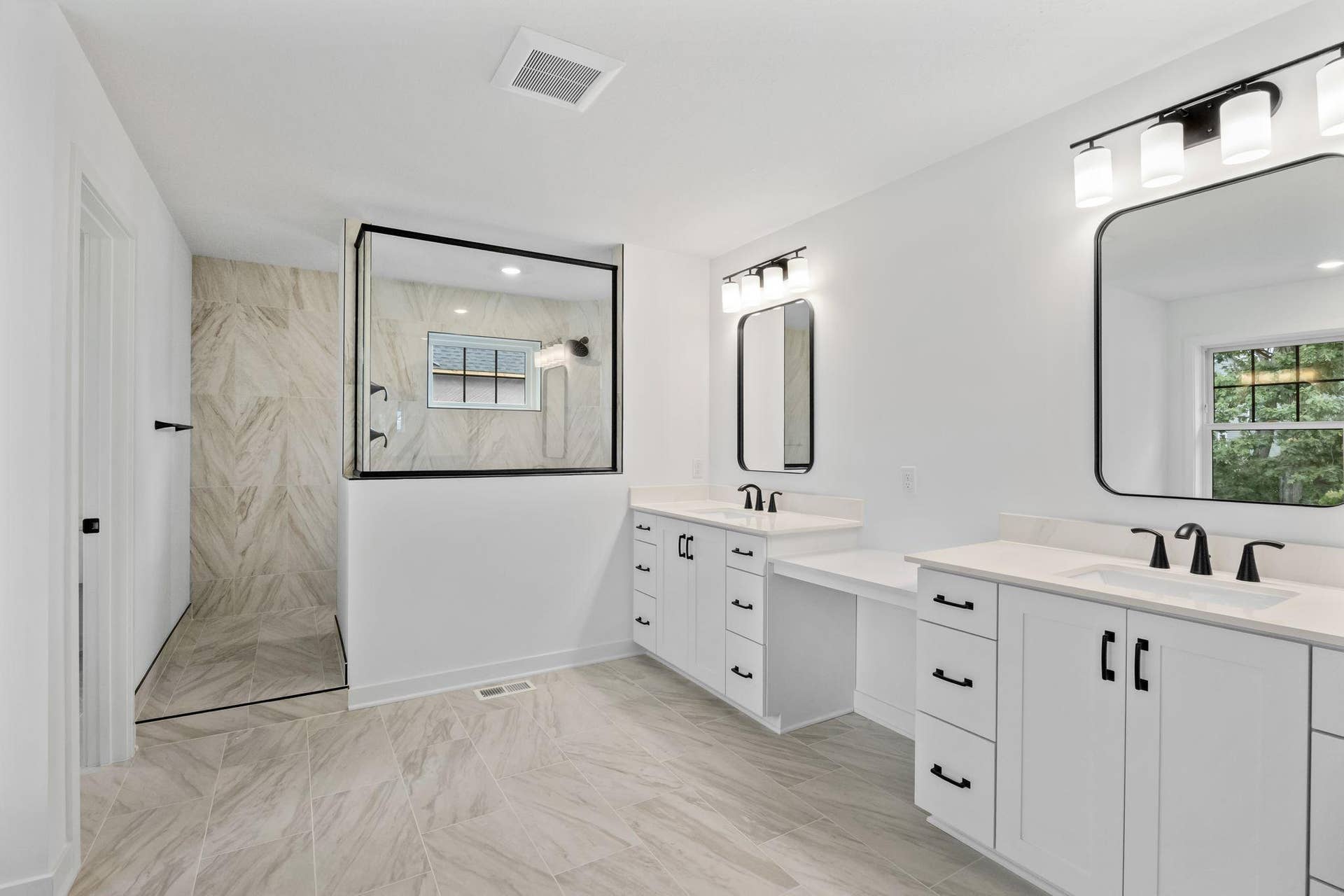 11168 Masters Street N, Lake Elmo, MN 55042 A walk-in shower with a ceramic tile surround complements a garden-style soaking tub in the owners bathroom