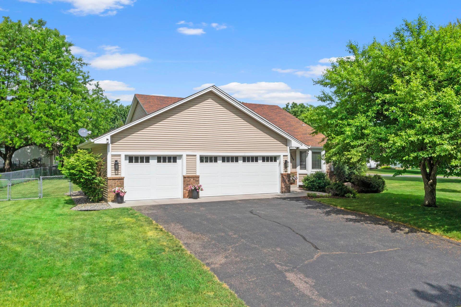 9840 Kirkwood Lane N, Maple Grove, MN 55369 Standout curb appeal and insulated 3 car gargae.