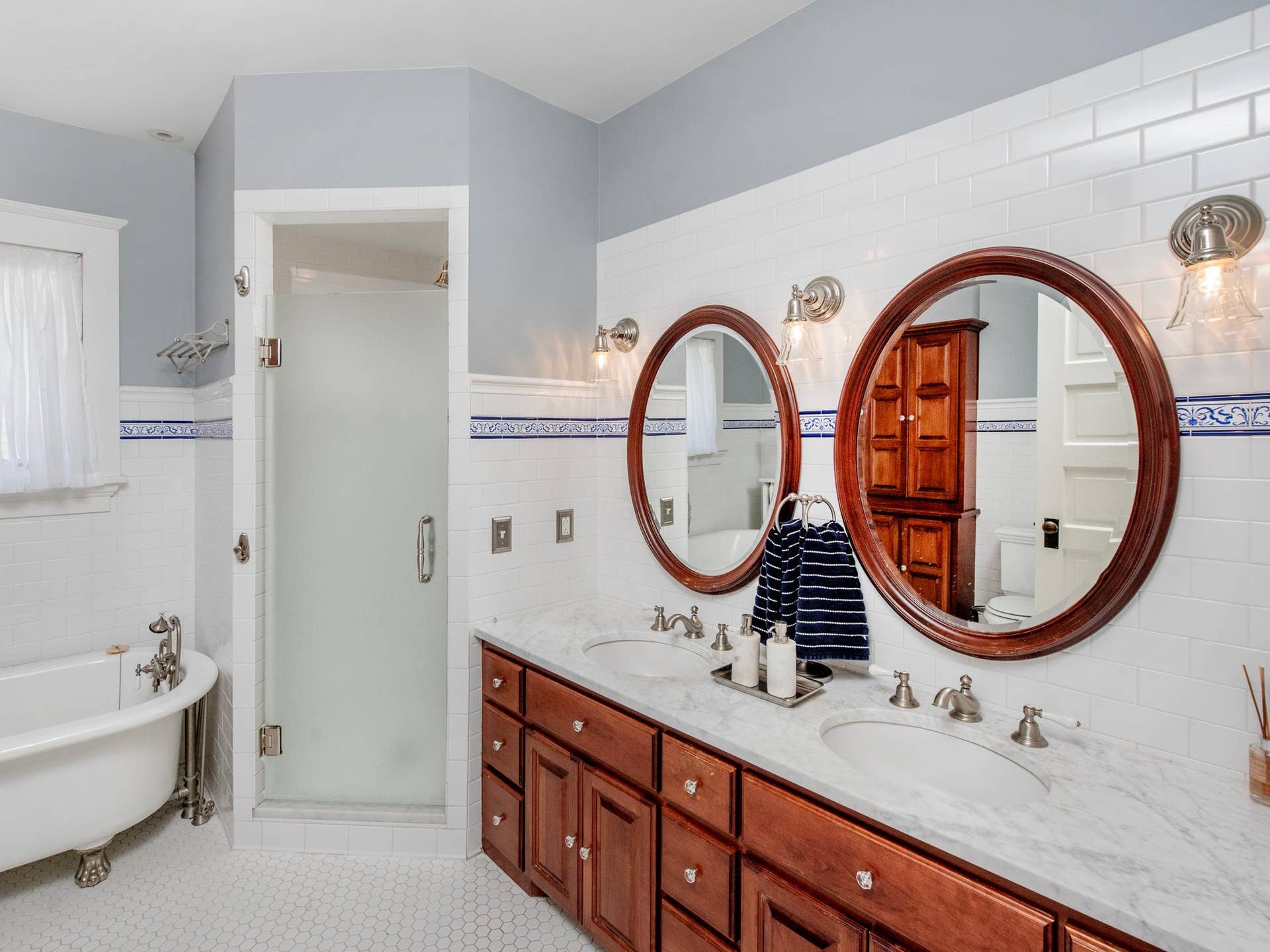 661 Fairmount Avenue, 100, Saint Paul, MN 55105 A spacious full bathroom with a clawfoot soaking tub and walk-in shower completes this level