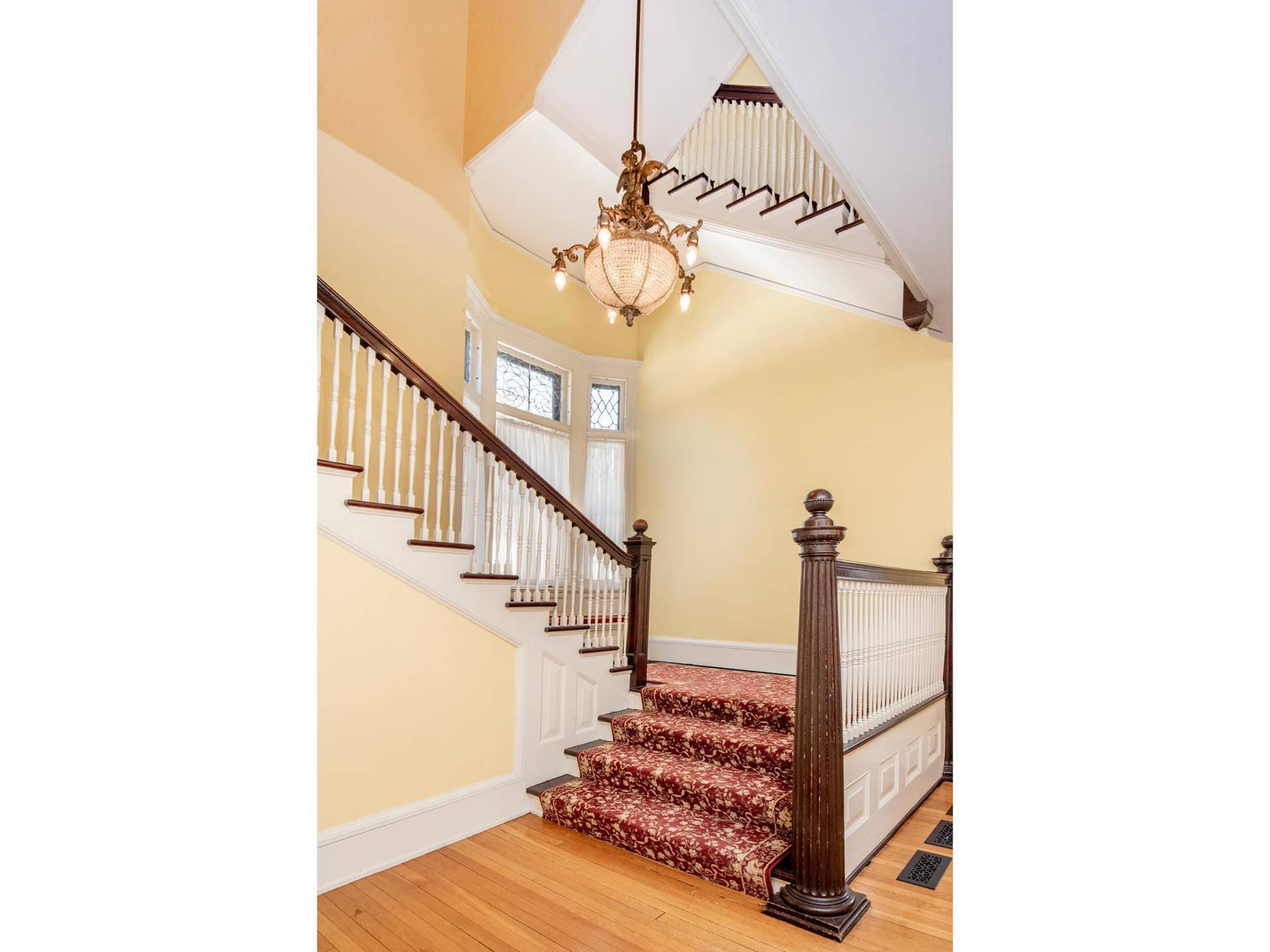 661 Fairmount Avenue, 100, Saint Paul, MN 55105 A breathtaking grand foyer sets the tone with a sweeping staircase, soaring ceilings, abundant natural light, and a charming bay window with a built-in window seat