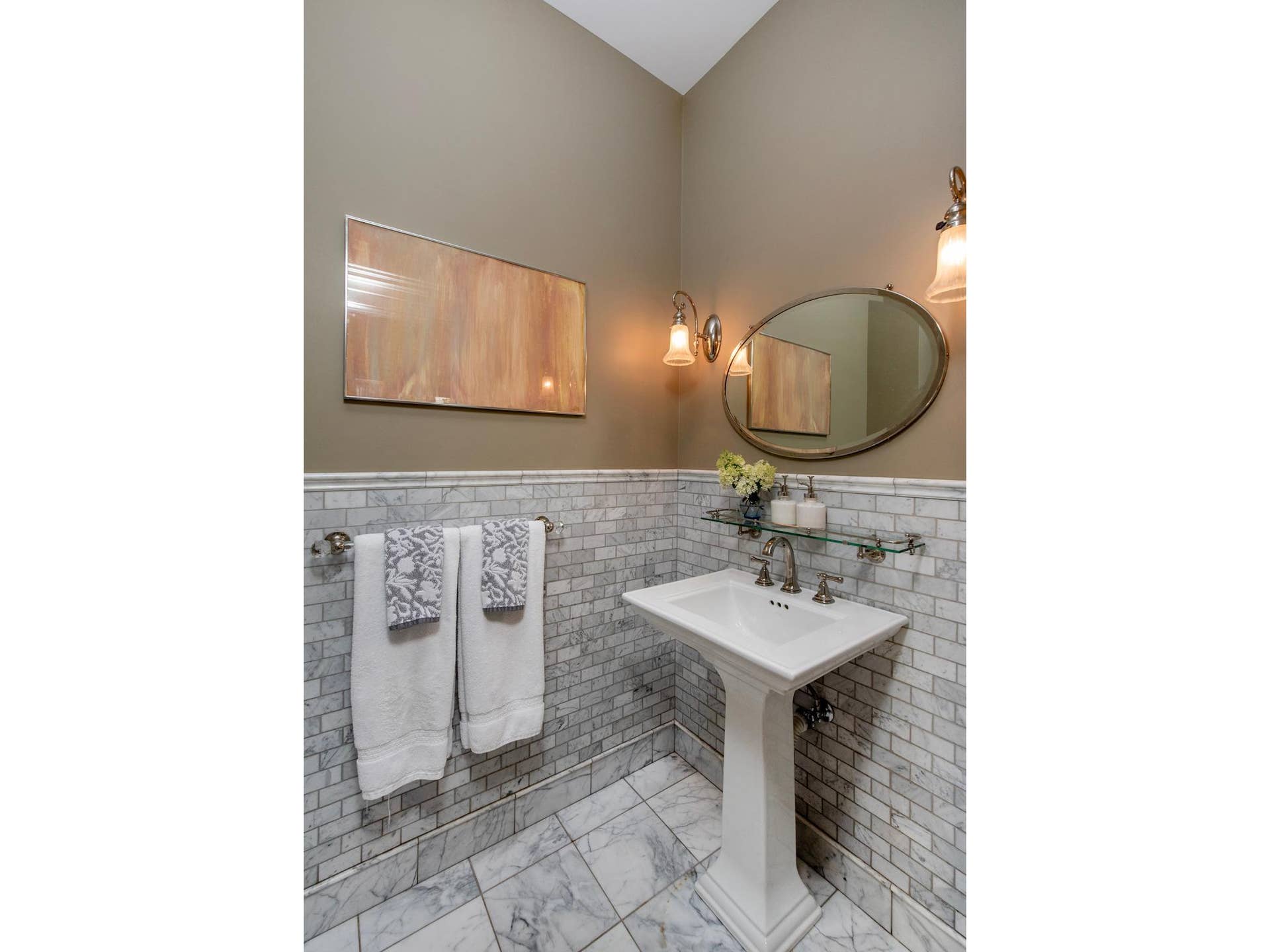 661 Fairmount Avenue, 100, Saint Paul, MN 55105 This adorable powder room with European marble tile and pedestal sink