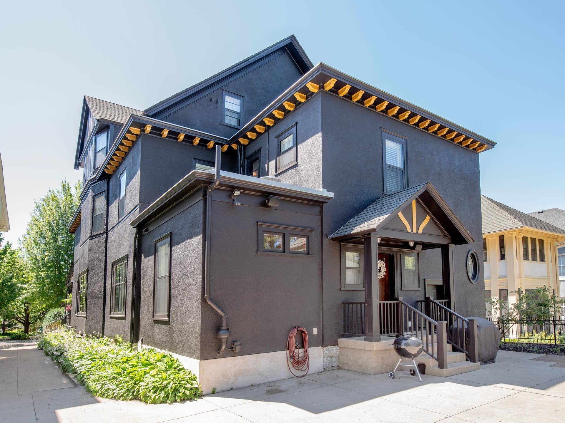 661 Fairmount Avenue, 100, Saint Paul, MN 55105 The shared driveway opens to a thoughtfully designed, low-maintenance backyard featuring a patio and a rare three-car garage