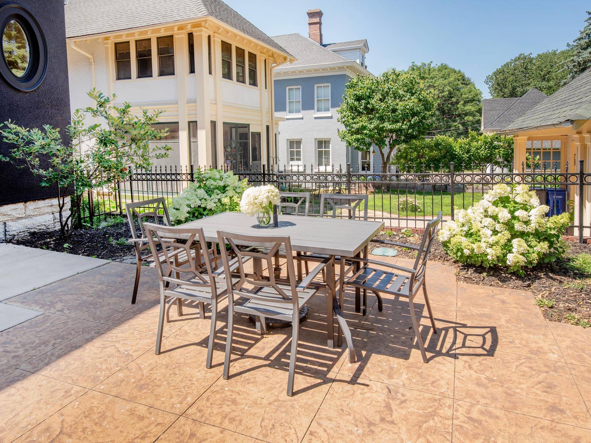 661 Fairmount Avenue, 100, Saint Paul, MN 55105 The backyard features a beautifully designed patio, creating the perfect setting for outdoor entertaining and relaxing