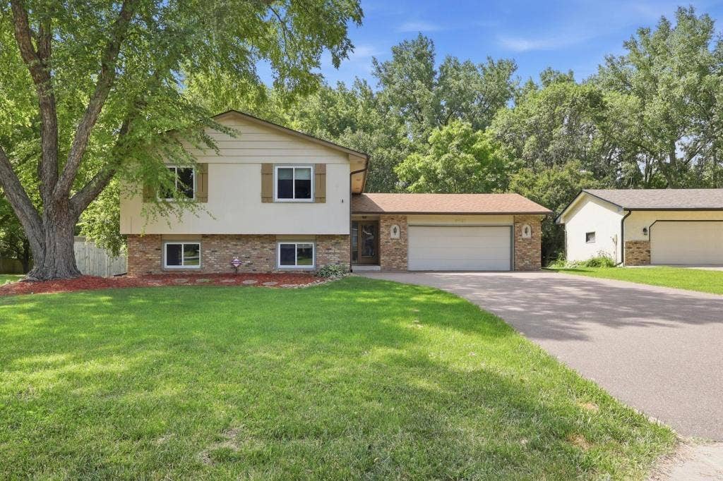 Welcome to 3501 77th Ave N. Tucked into Parkland Woods on a manicured corner lot, this 4-bedroom split-entry pairs timeless curb appeal with mature trees, warm character, and spaces that instantly feel like home.