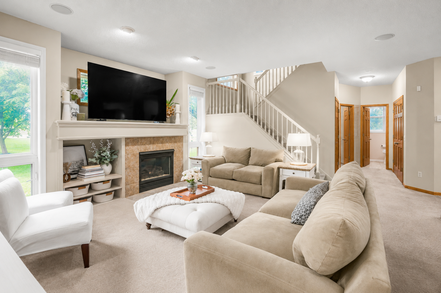 15350 Elm Road, Maple Grove, MN 55311 This home includes a welcoming main-level living room with fireplace and built-ins, flexible front living spaces, an upper-level loft, and a large finished lower-level recreation room.