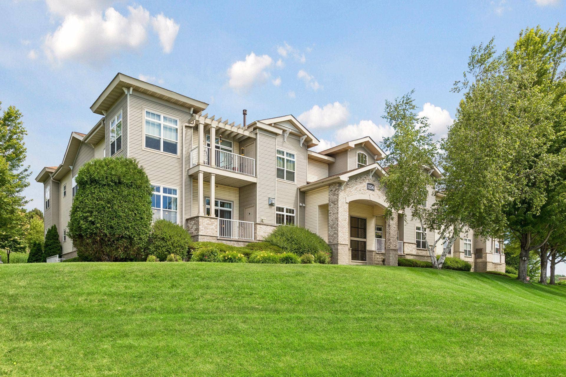 Positioned on a desirable end-unit location within a well-maintained building, this light-filled condominium offers an appealing blend of comfort, convenience, and privacy