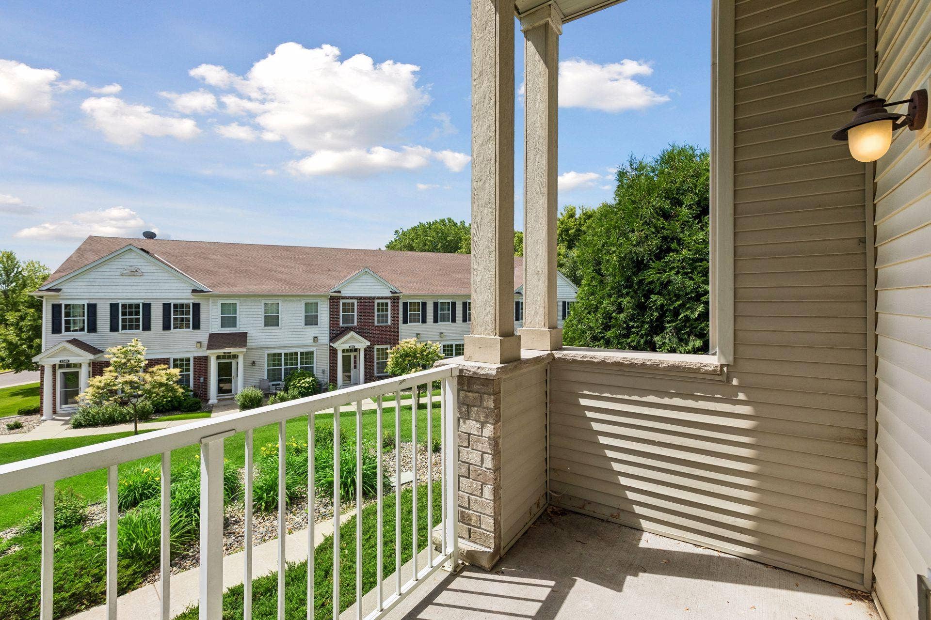 With room for a bistro set and a collection of seasonal plantings, it becomes a natural extension of the home's living space.