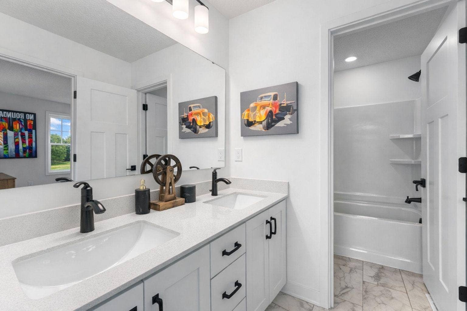 1848 Royal Boulevard N, Lake Elmo, MN 55042 This full-sized bathroom features a vanity with convenient dual sinks that close off from the shower and tub combo for extra privacy. It is directly accessible from an adjacent bedroom..jpg