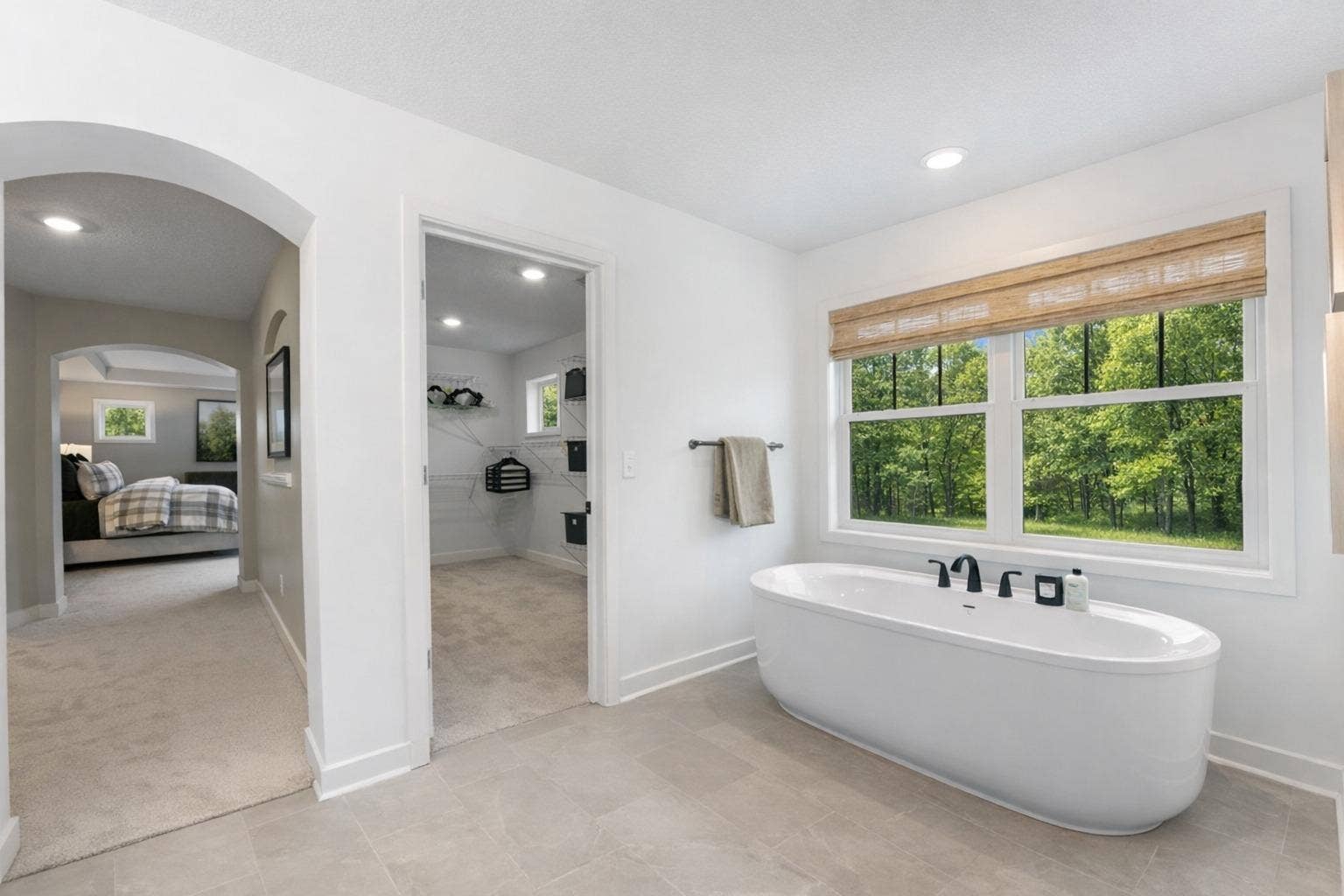 1848 Royal Boulevard N, Lake Elmo, MN 55042 A freestanding tub and rain glass window is perfect for sun-dappled soaks and rejuvenation.jpg