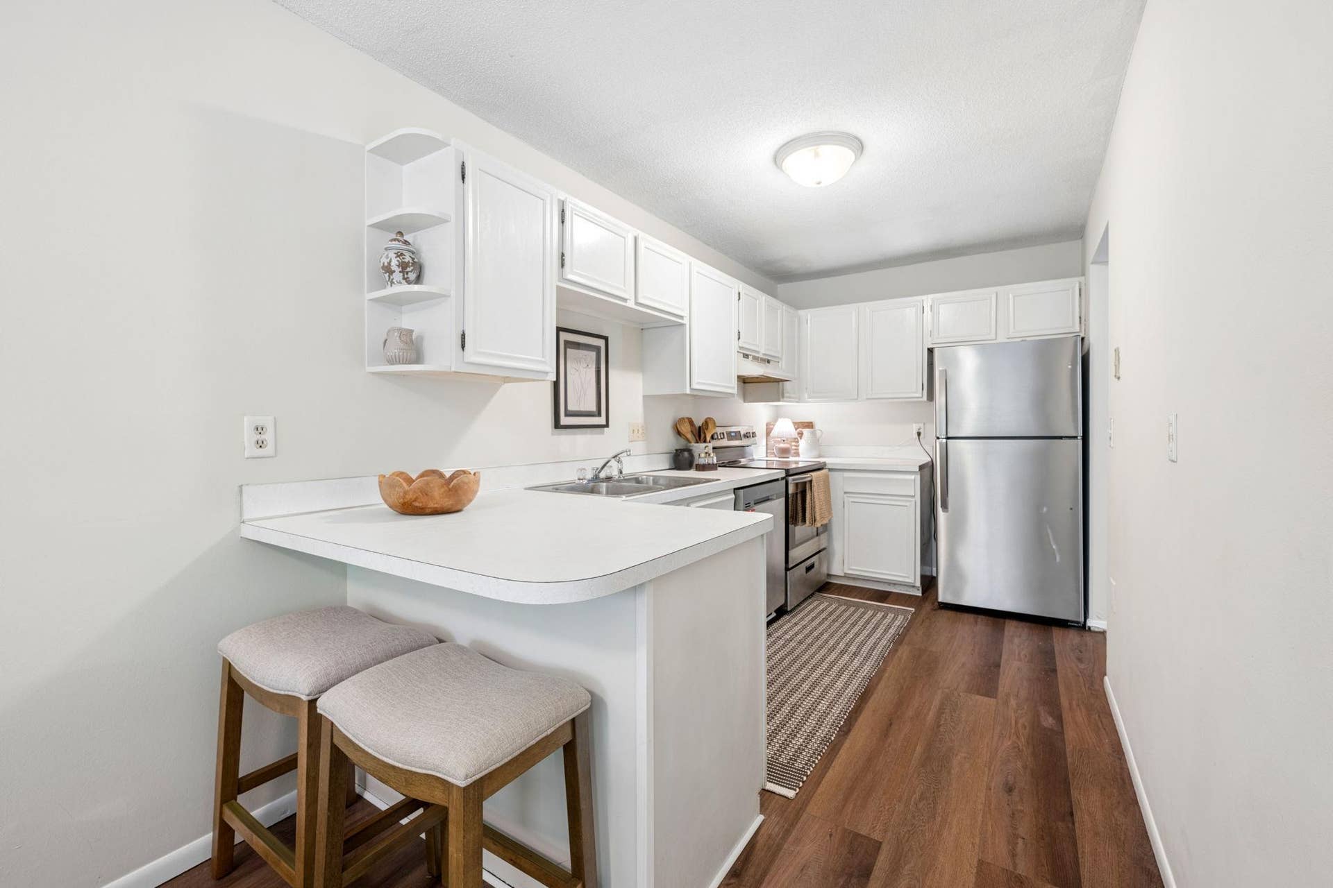 10731 Aquila Avenue S, Bloomington, MN 55438 Ample storage space and stainless steel appliances highlight this galley style kitchen.