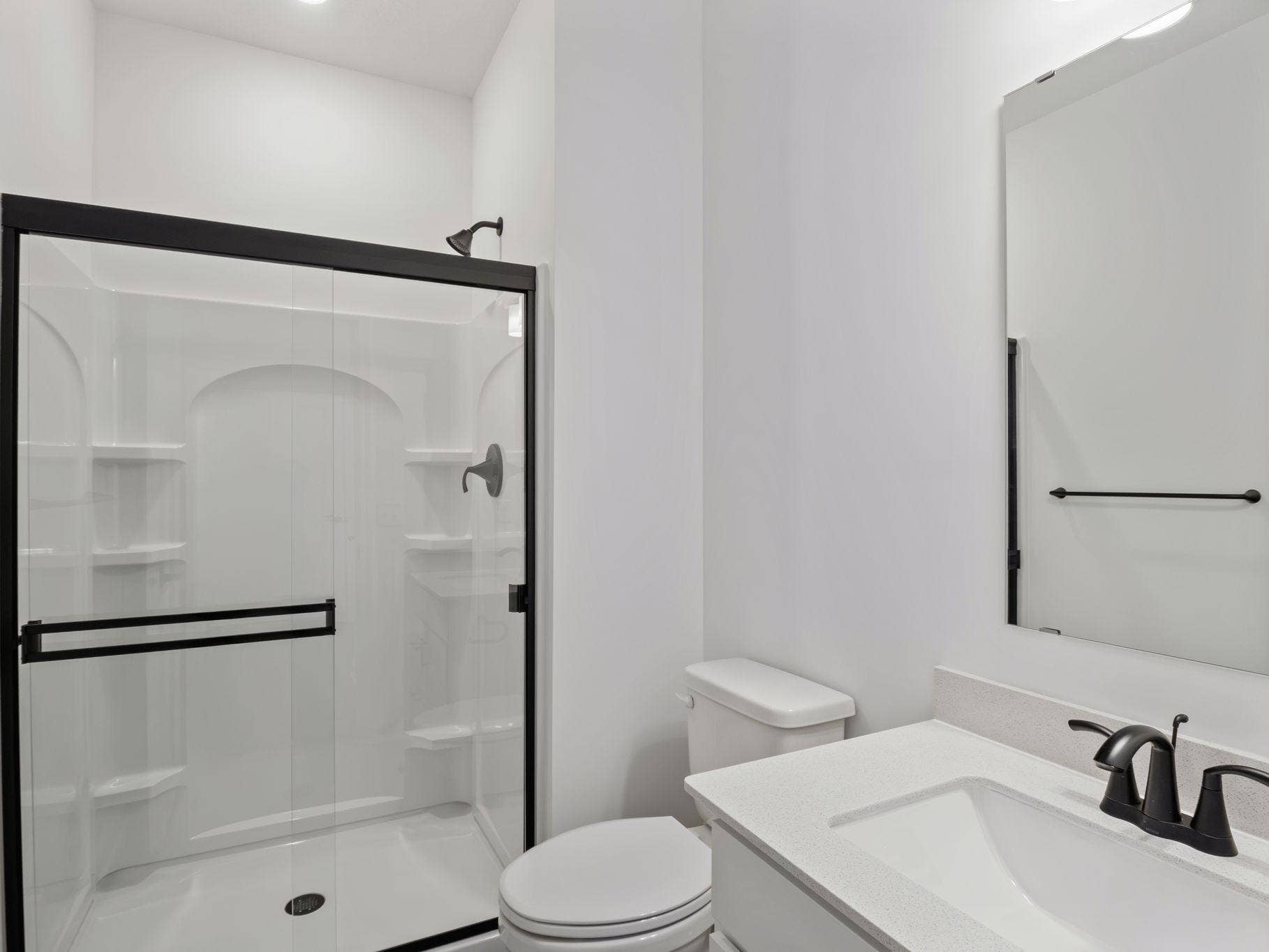 8656 Periwinkle Boulevard, Woodbury, MN 55129 Conveniently placed near the Great Room, this bathroom is conveniently trucked away with privacy in mind.