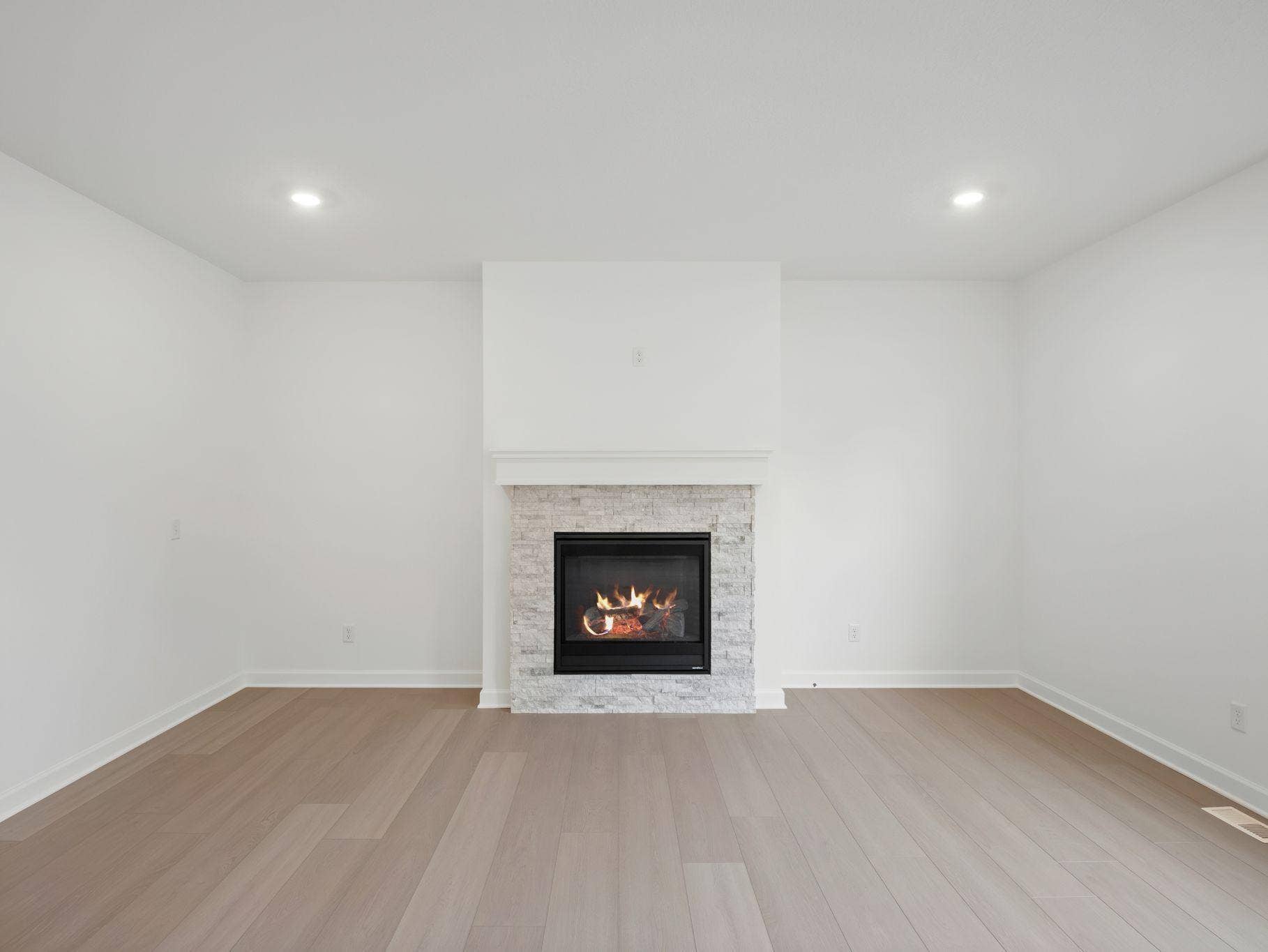 8656 Periwinkle Boulevard, Woodbury, MN 55129 The Great Room features large windows for ample natural light and is the perfect place for gathering with friends and family.
