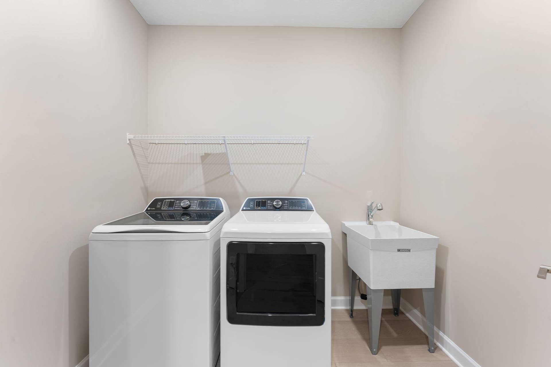 5184 Long Pointe Bay, Woodbury, MN 55129 With ventilated shelving and washer-dryer hookups, the laundry room helps keep the home tidy during busy chore days.