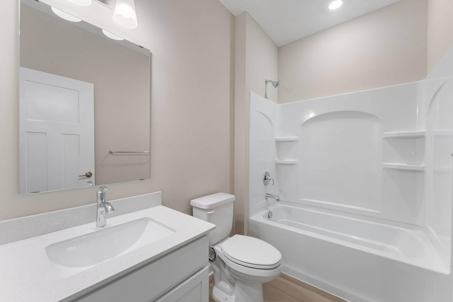 5184 Long Pointe Bay, Woodbury, MN 55129 This full-sized bathroom is between the secondary bedrooms and features a single vanity and a shower-tub combination.